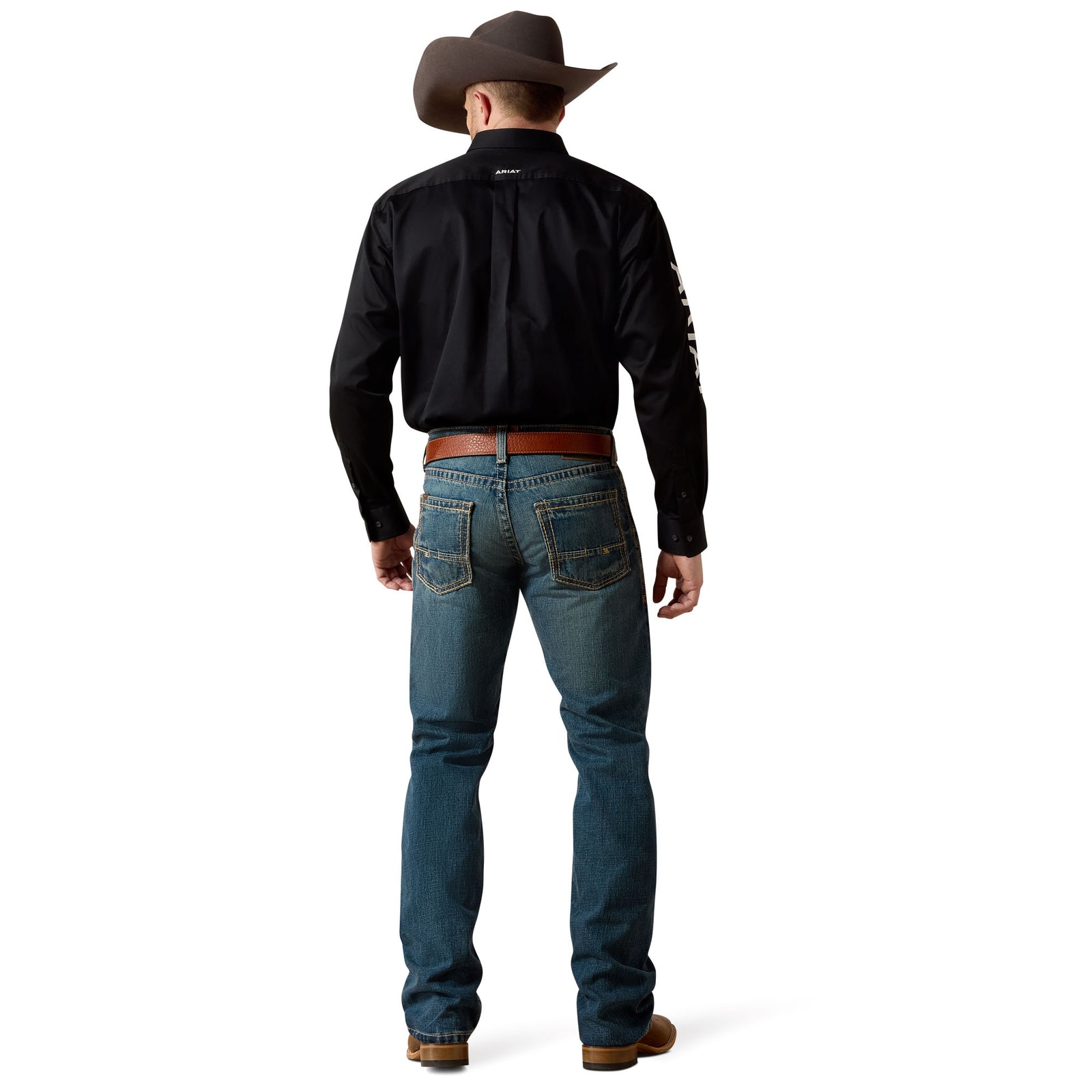 Ariat Men's M5 Boundary Straight Leg Jean. Person wearing blue jeans and brown boots on a white background