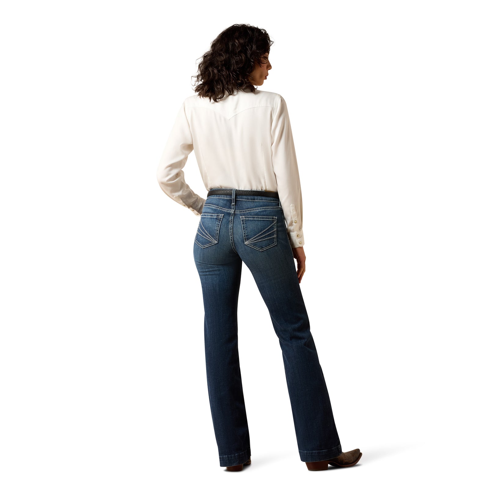 Person wearing blue jeans and a white shirt on a white background