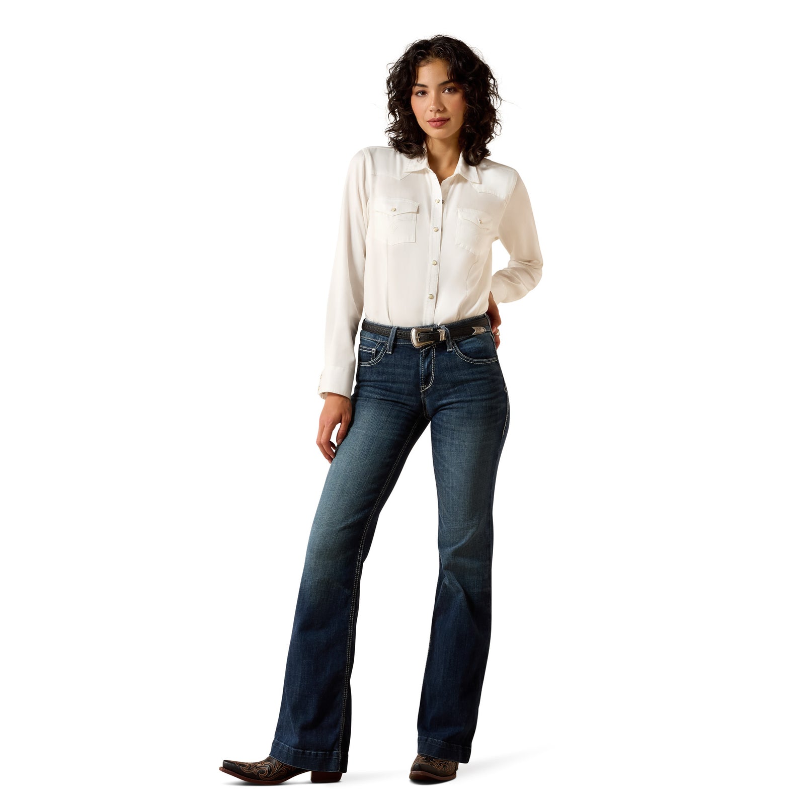 Woman wearing a white shirt and blue jeans on a white background
