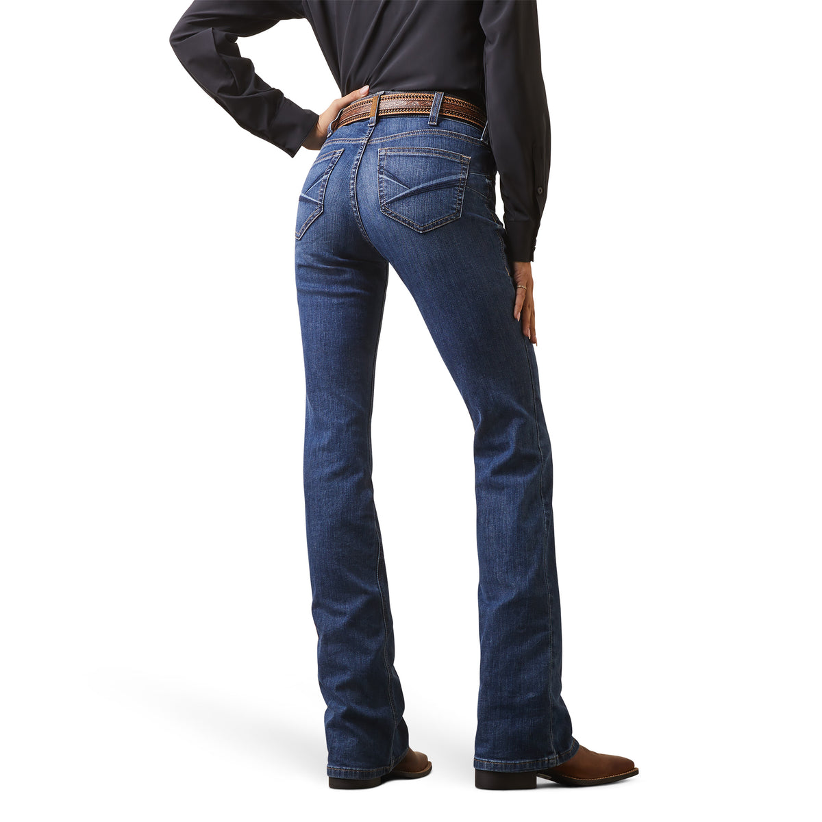 Person wearing blue jeans on a white background