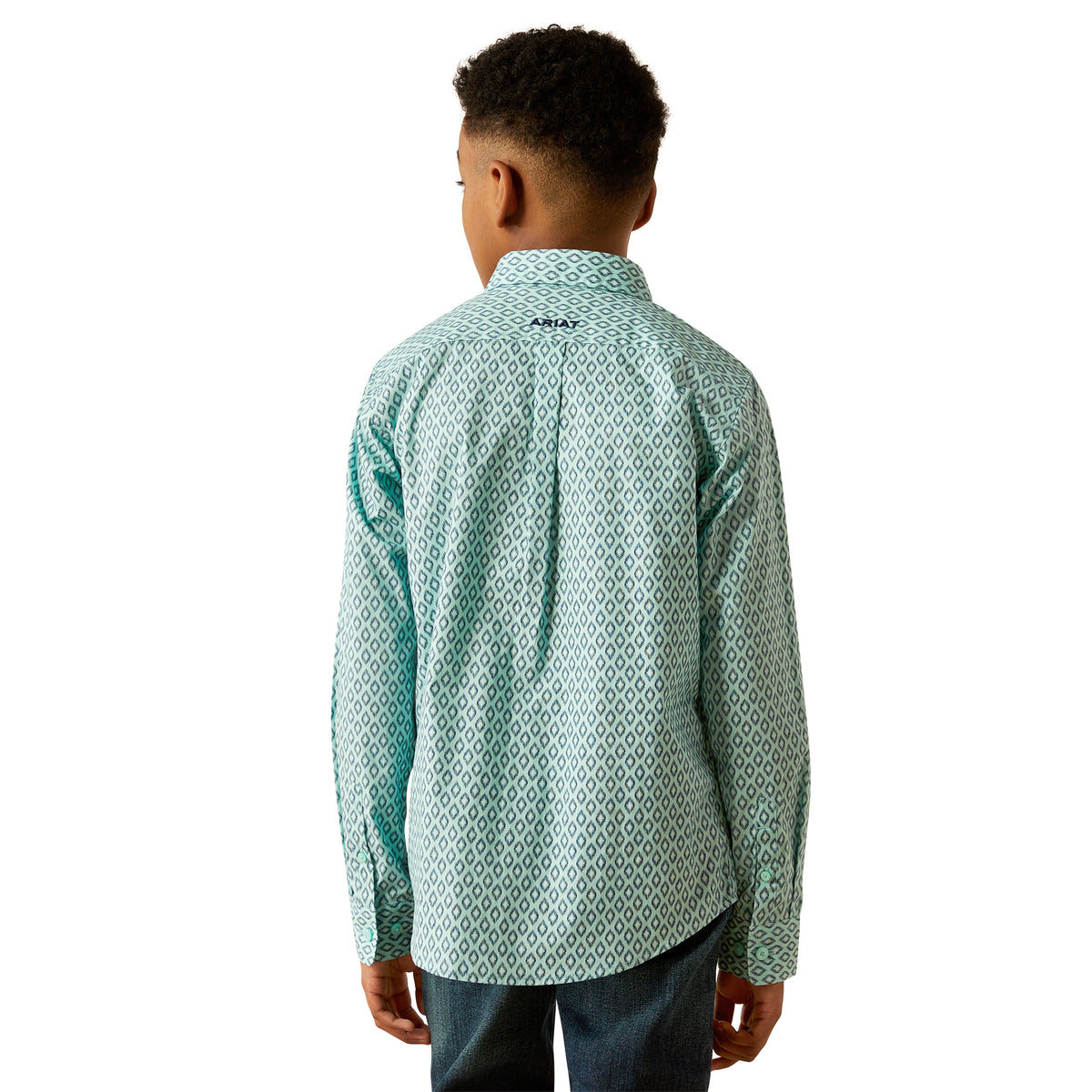 Ariat Boy's Canyon L/S Western Shirt. Person wearing a patterned shirt with a visible brand logo on a white background
