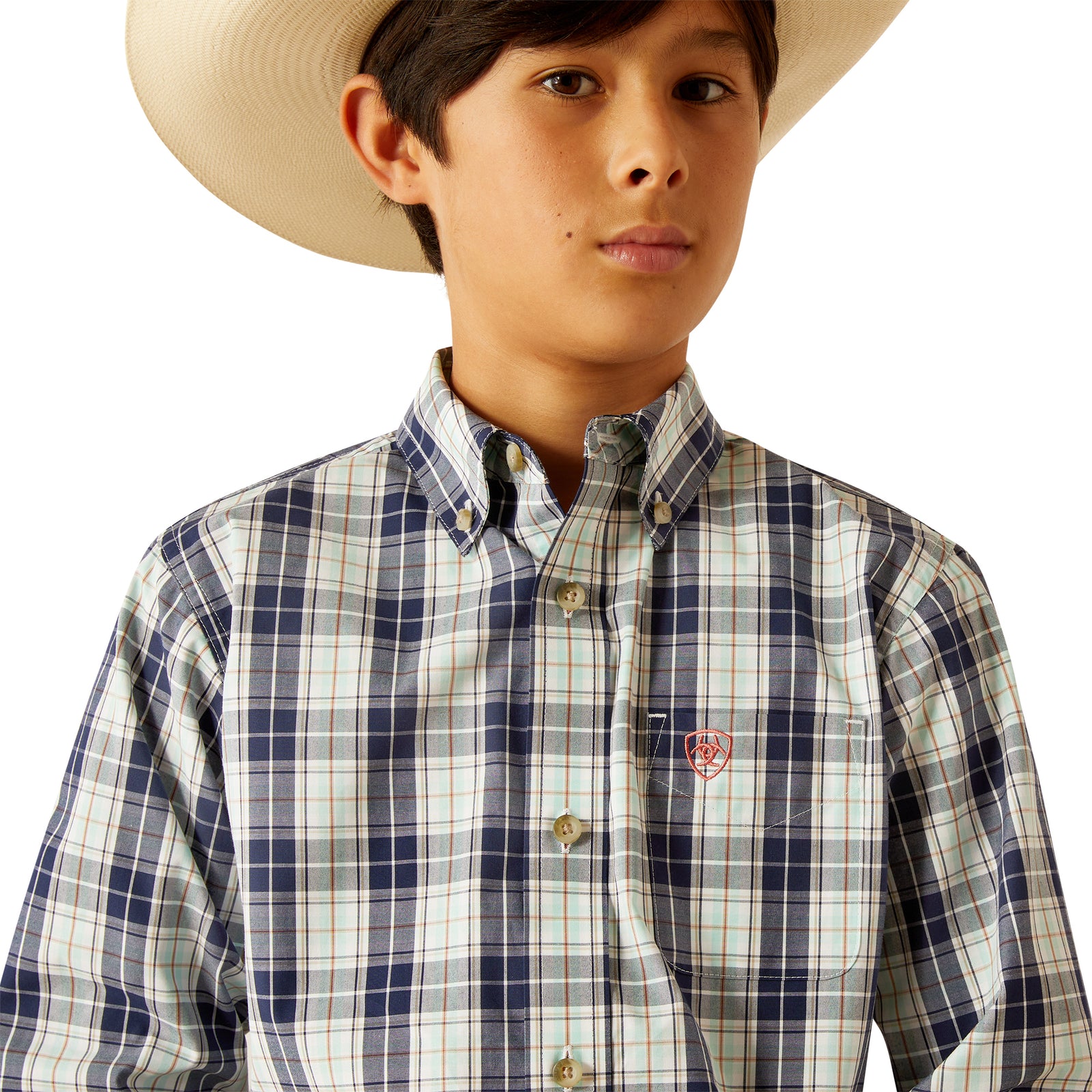 Ariat Boy's Pro Series Curtis L/S Western Shirt. Child wearing a plaid shirt, jeans, and a cowboy hat on a white background