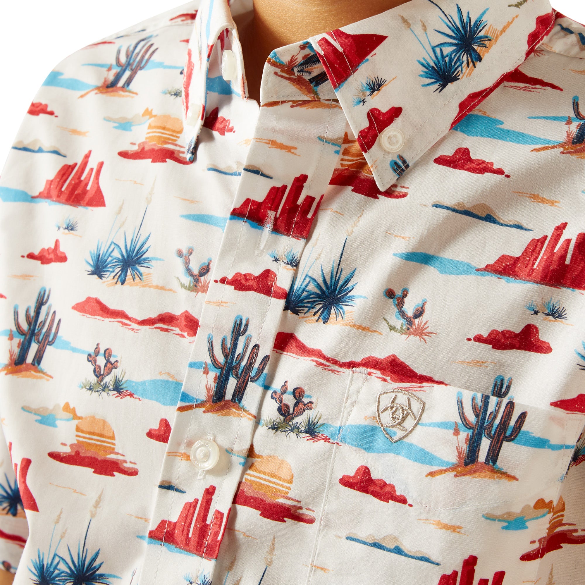 Ariat Boy's Scout S/S Western Shirt. Child wearing a colorful patterned shirt on a white background