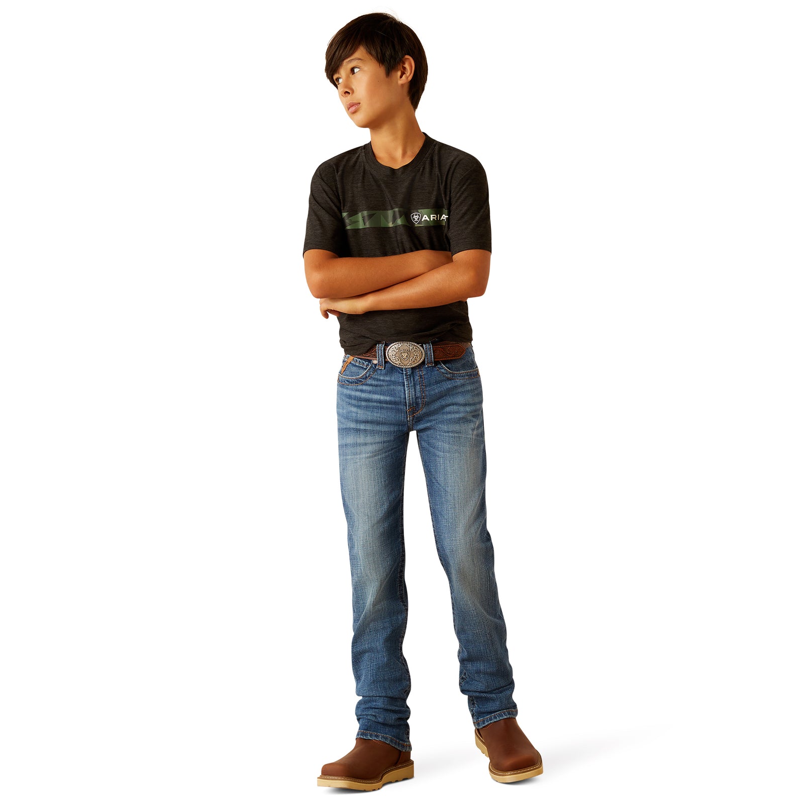 Ariat Boy's B5 Norwich Slim Fit Jean. Person wearing a black t-shirt with a logo and blue jeans on a white background