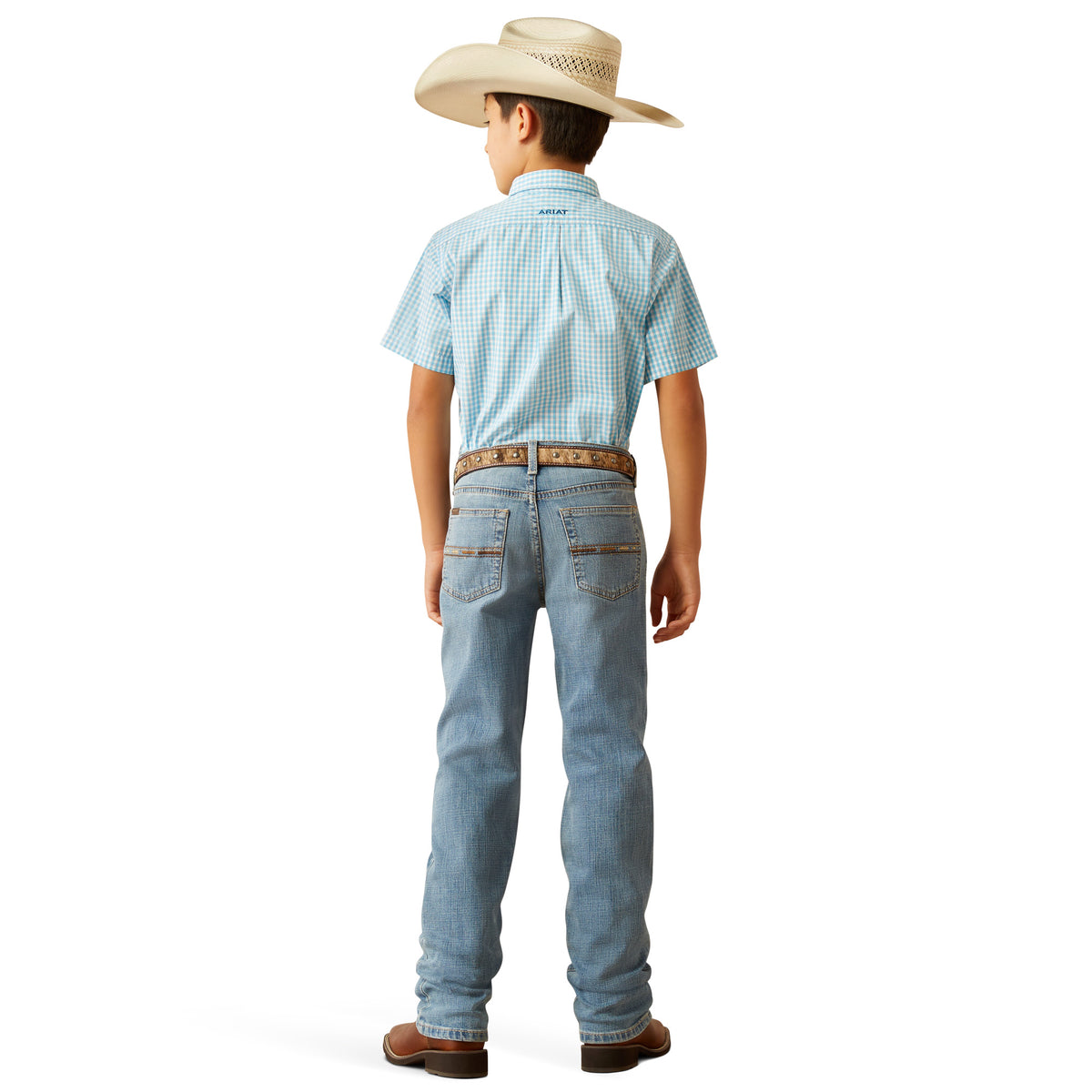 Ariat Boy's B4 Relaxed Jones Boot Cut Jeans. Child wearing a light blue checkered shirt, jeans, and a cowboy hat on a white background