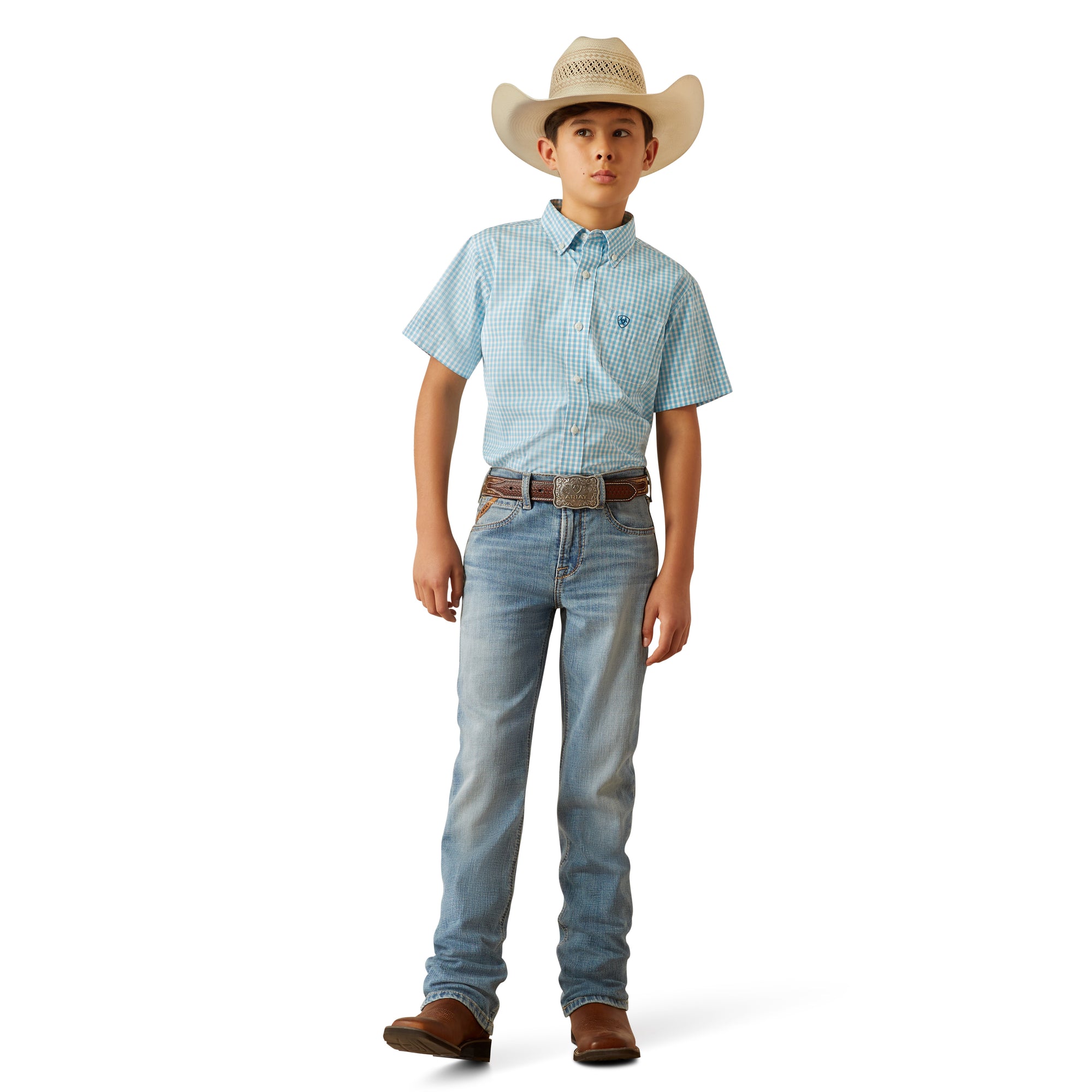 Ariat Boy's B4 Relaxed Jones Boot Cut Jeans. Child wearing a light blue checkered shirt, jeans, and a cowboy hat on a white background