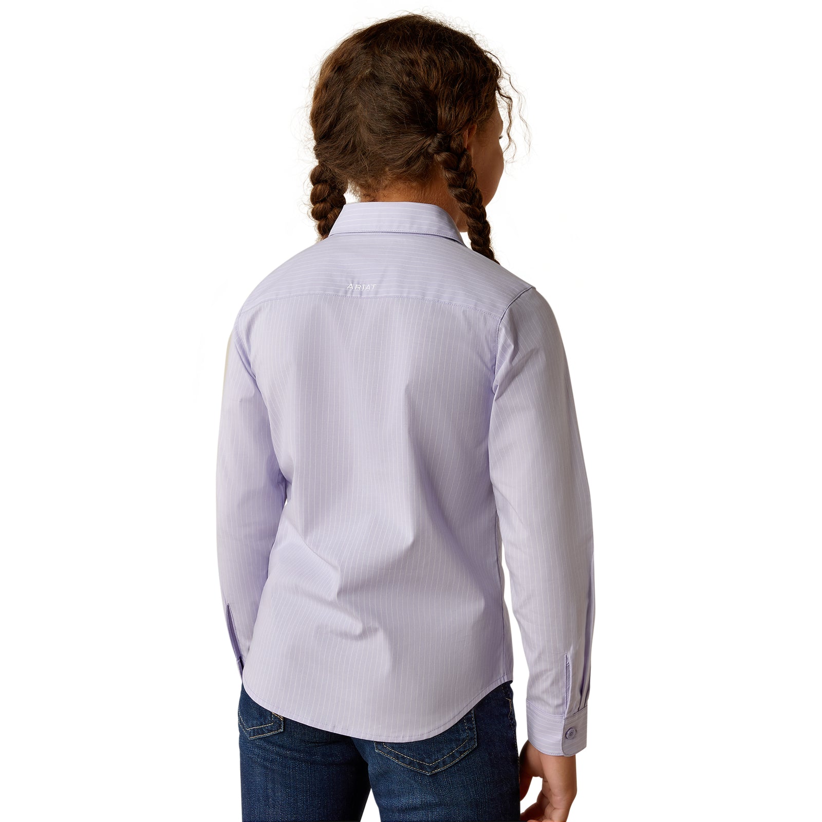 Ariat Girl's Kirby L/S Western Shirt. Young girl wearing a light purple dress shirt and blue jeans on a white background