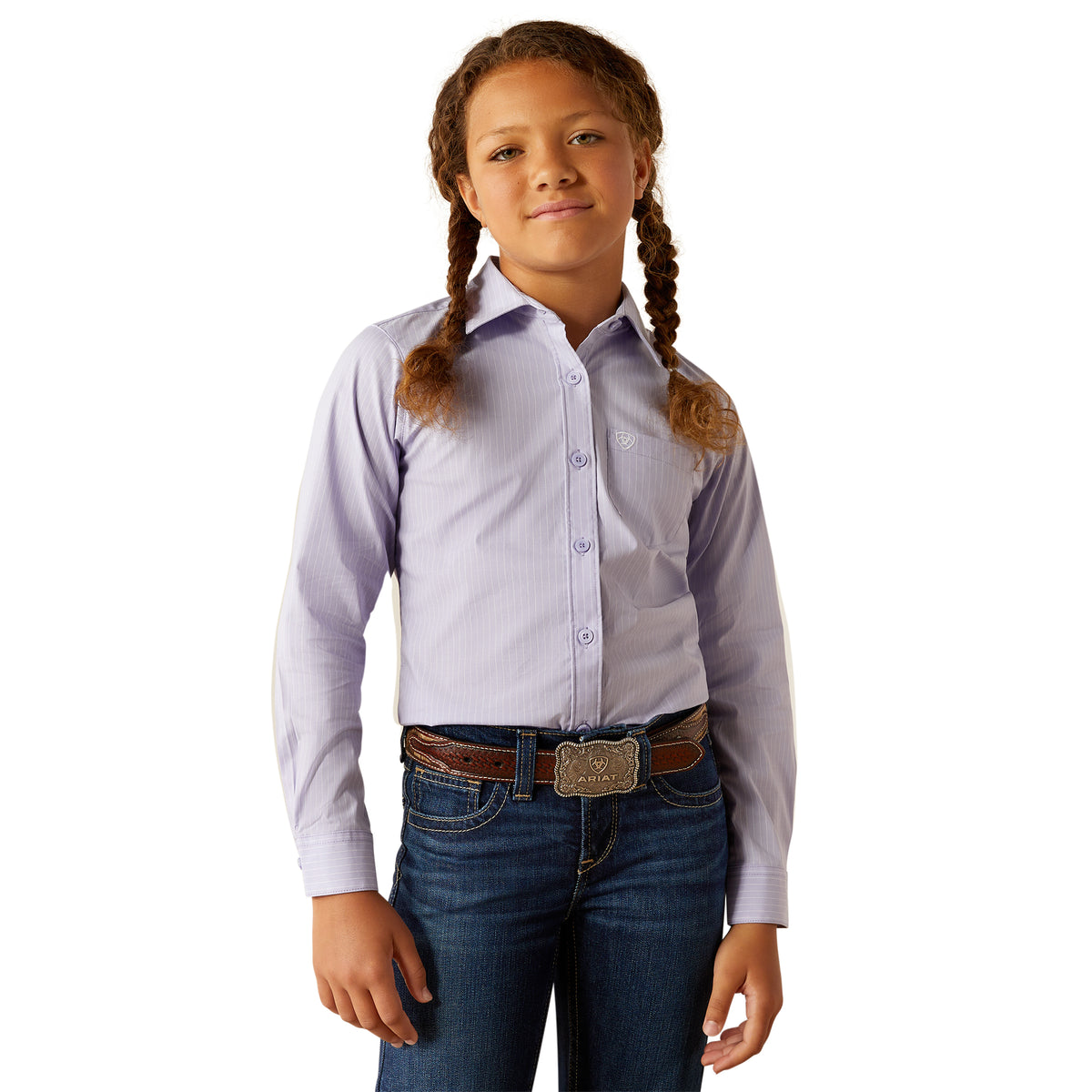 Ariat Girl&#39;s Kirby L/S Western Shirt. Young girl wearing a light purple dress shirt and blue jeans on a white background