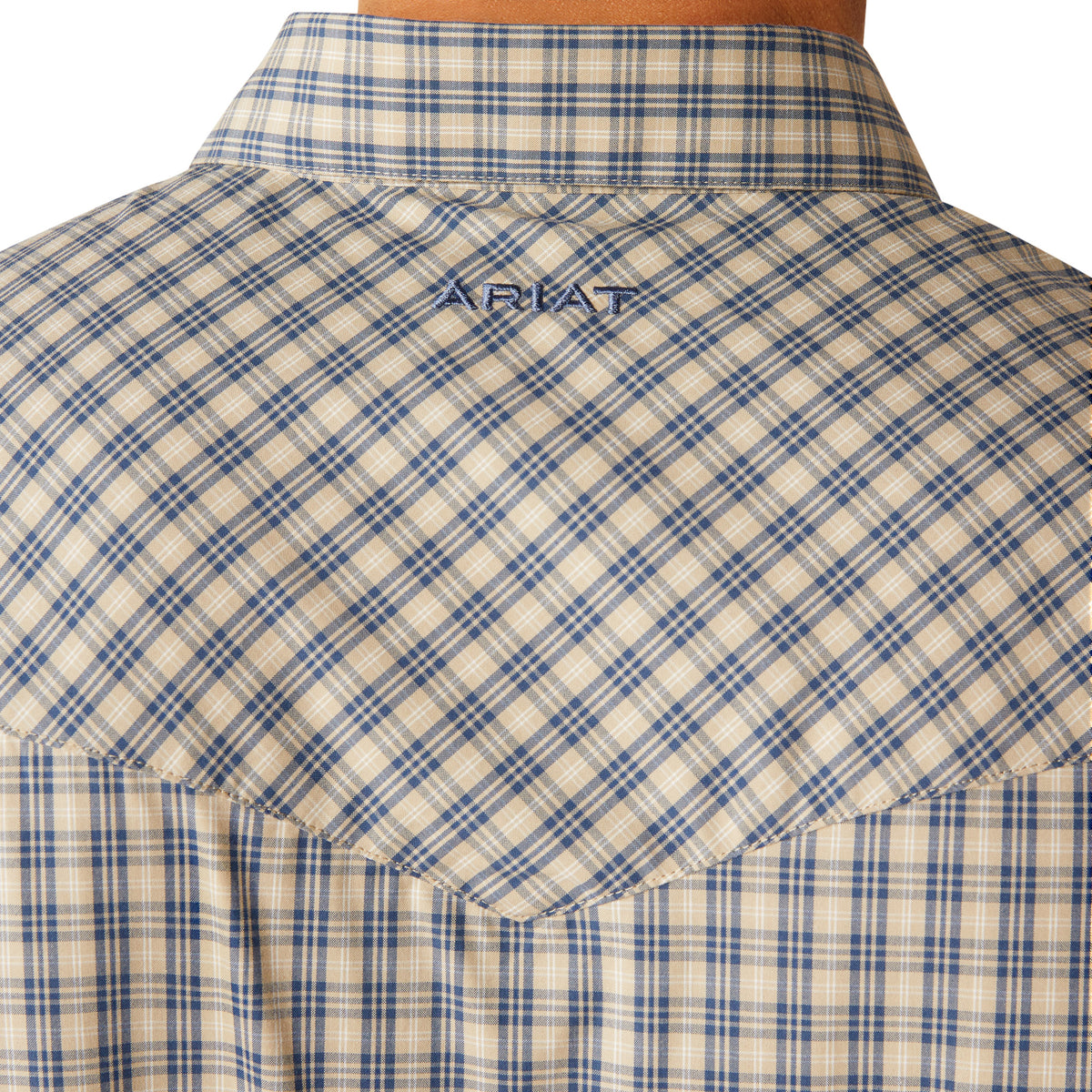 Ariat Men's Pro Series Fairbanks L/S Western Shirt. Close-up of a blue and beige plaid shirt with a brand logo on the collar.
