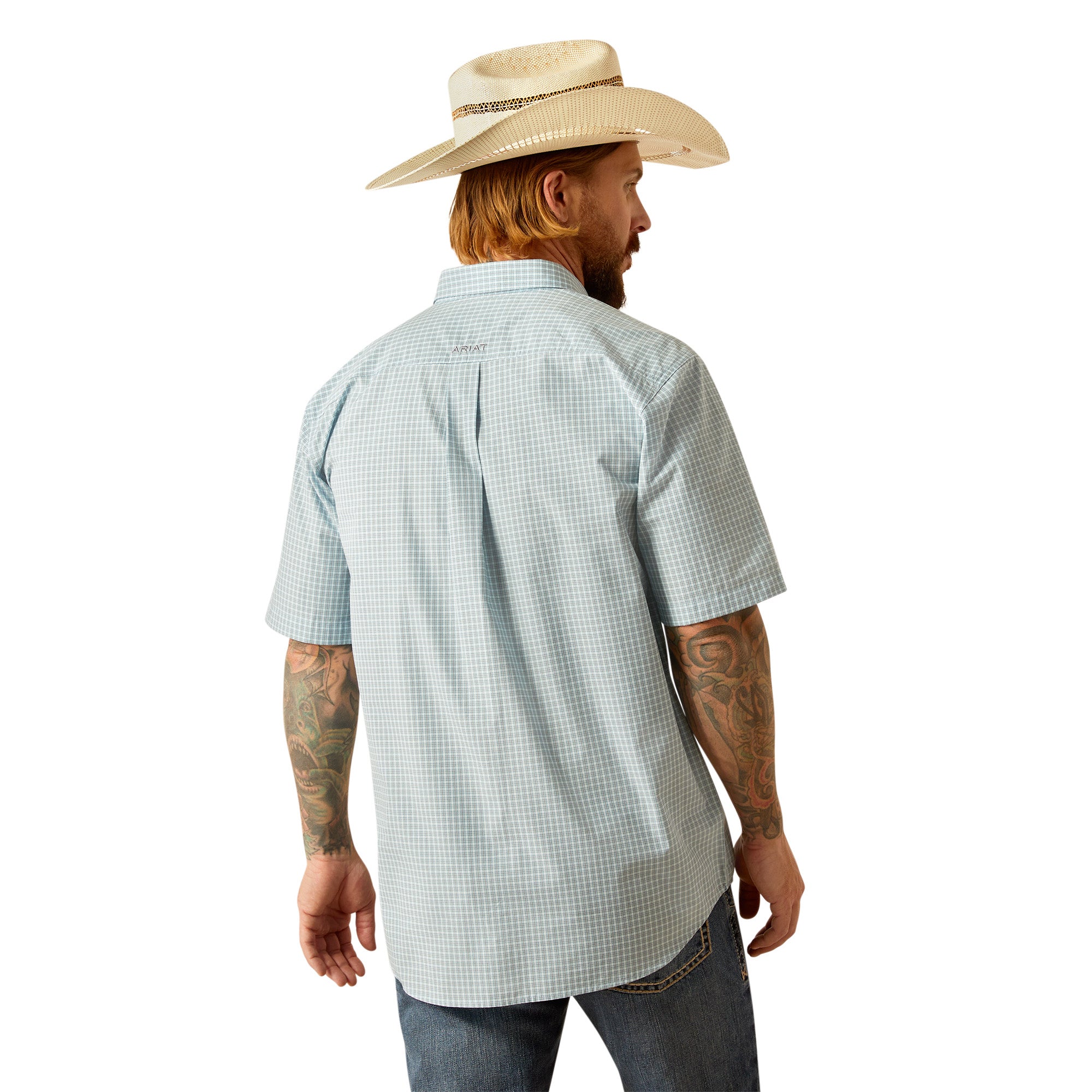 Ariat Men's Pro Series Glennie Classic Fit S/S Western Shirt. Man wearing a light blue checkered shirt, jeans, and a cowboy hat on a white background