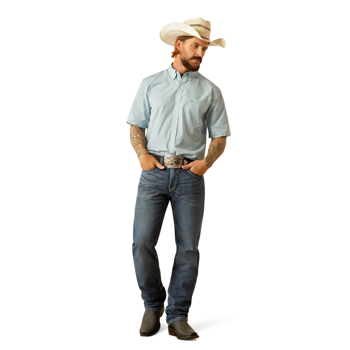 Ariat Men's Pro Series Glennie Classic Fit S/S Western Shirt. Man wearing a light blue shirt, jeans, and a cowboy hat on a white background