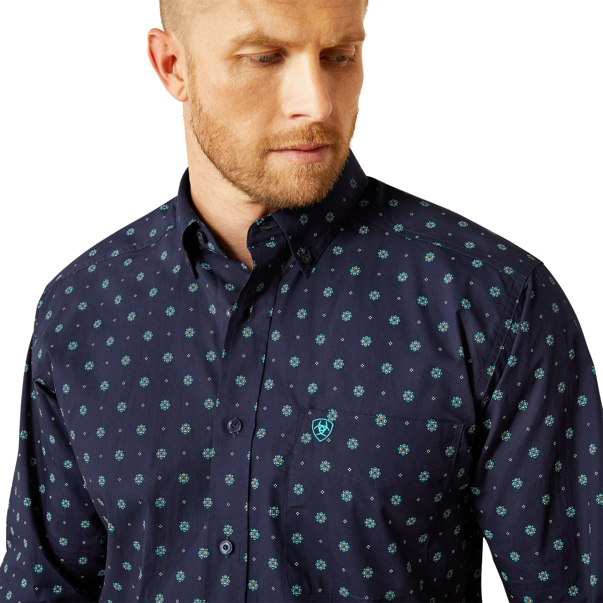 Ariat Men's Jacobi Classic Fit L/S Western Shirt. Man wearing a navy blue shirt with a subtle pattern on a white background