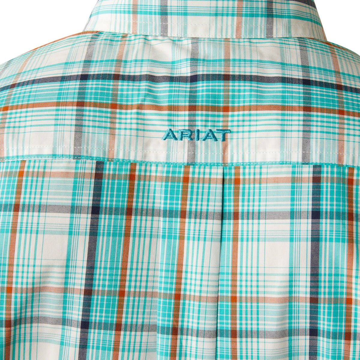Ariat Men's Pro Series Justice Classic Fit L/S Shirt. Close-up of a plaid shirt with 'Ariat' branding on a white background