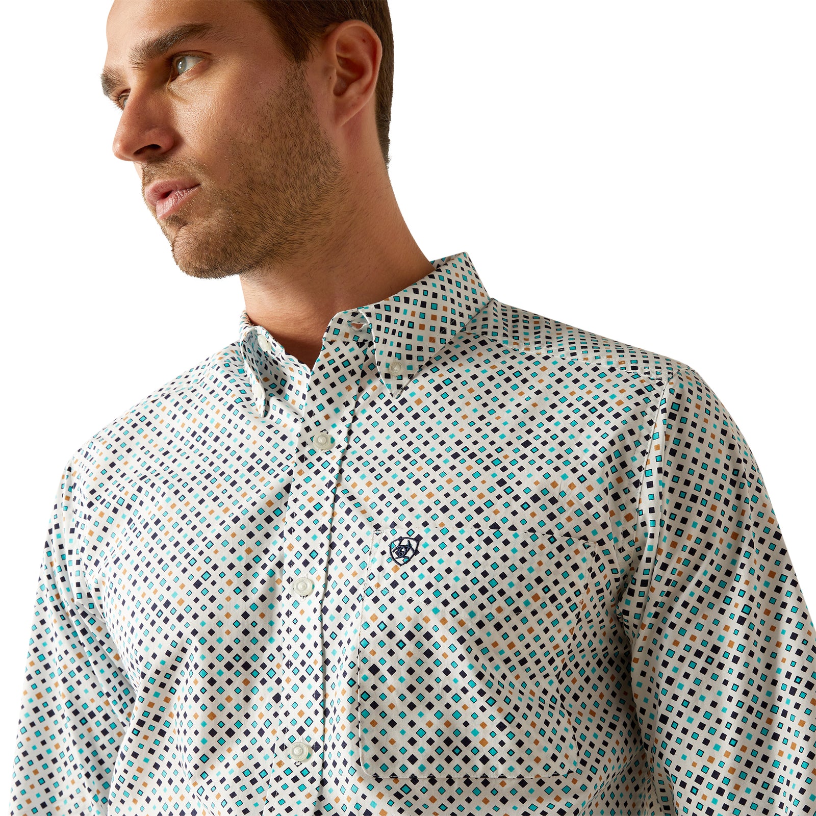 Ariat Men's Jansen Fitted L/S Western Shirt. Man wearing a patterned shirt and dark pants on a white background