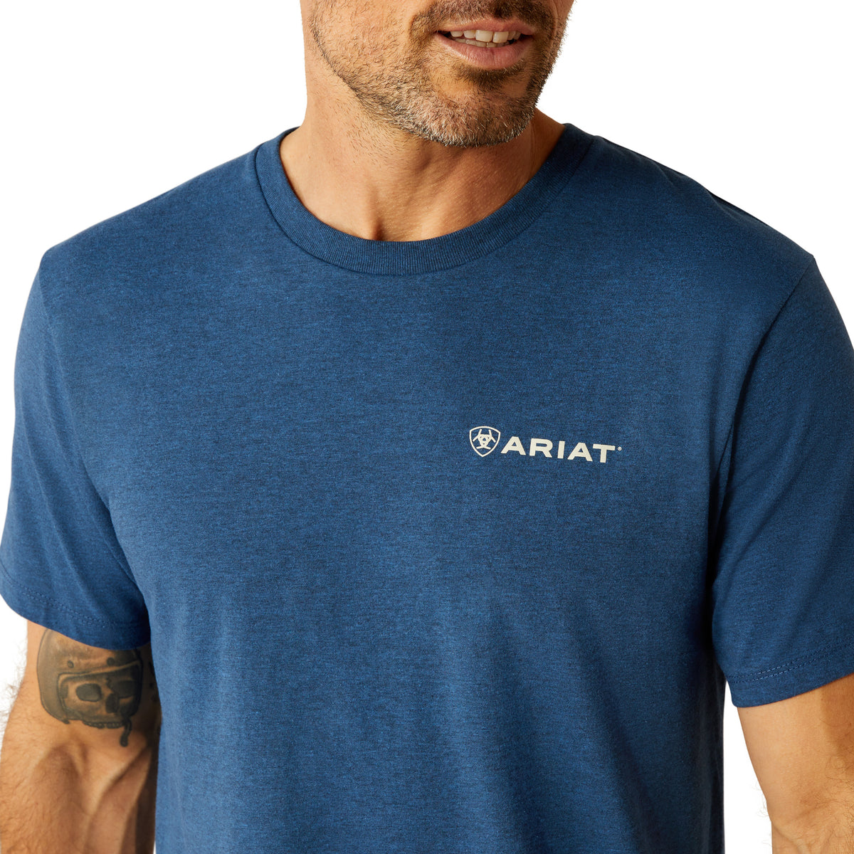 Ariat Men's Line Frame Hex T-Shirt. Man wearing a blue Ariat t-shirt on a white background
