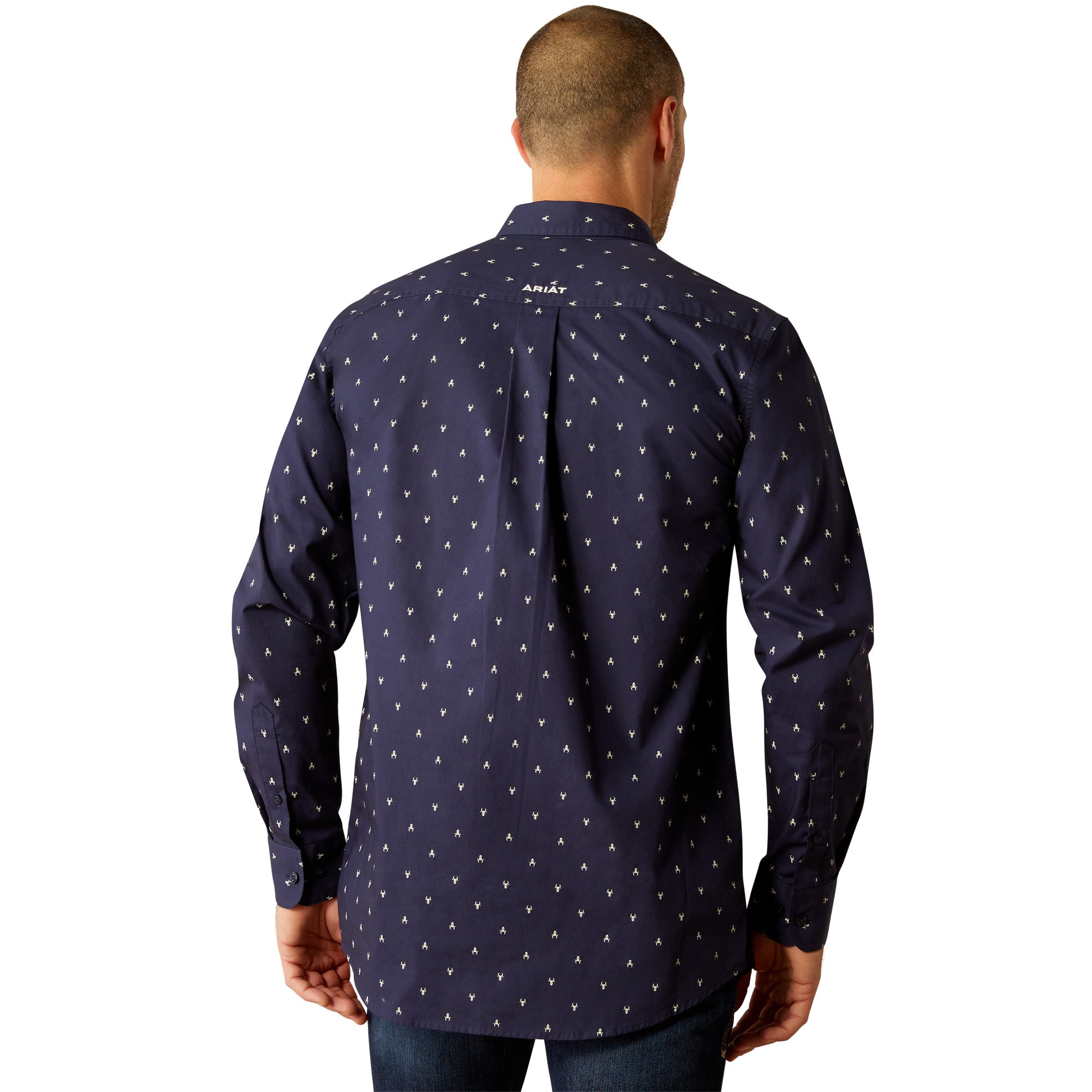 Ariat Men's Cordell Retro Fit L/S Western Shirt. Man wearing a navy patterned shirt, jeans, and a straw cowboy hat on a white background