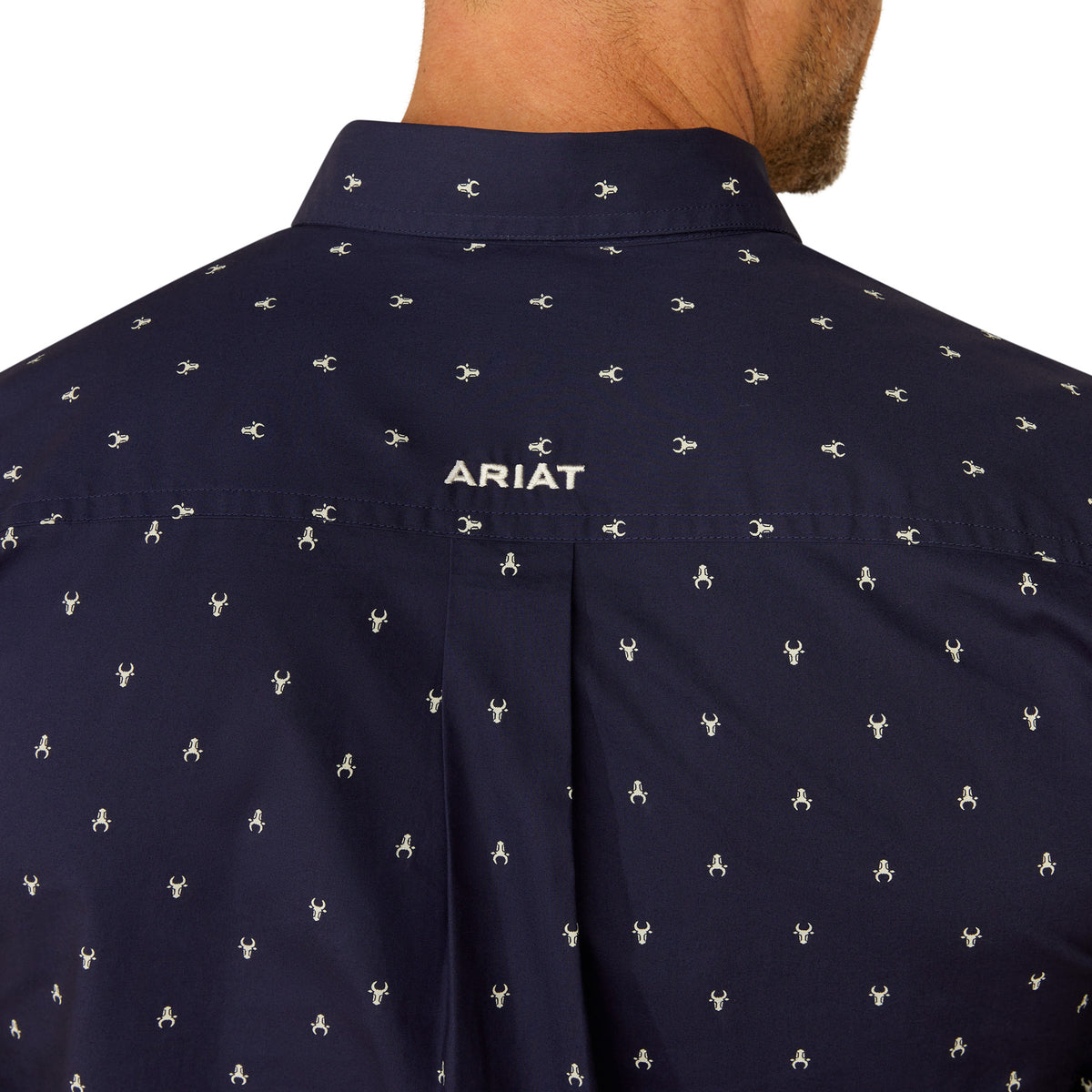 Ariat Men's Cordell Retro Fit L/S Western Shirt. Navy blue shirt with white pattern and Ariat logo on collar