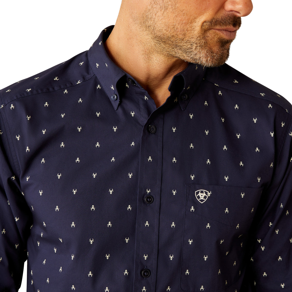 Ariat Men's Cordell Retro Fit L/S Western Shirt. Navy blue shirt with white pattern worn by a person