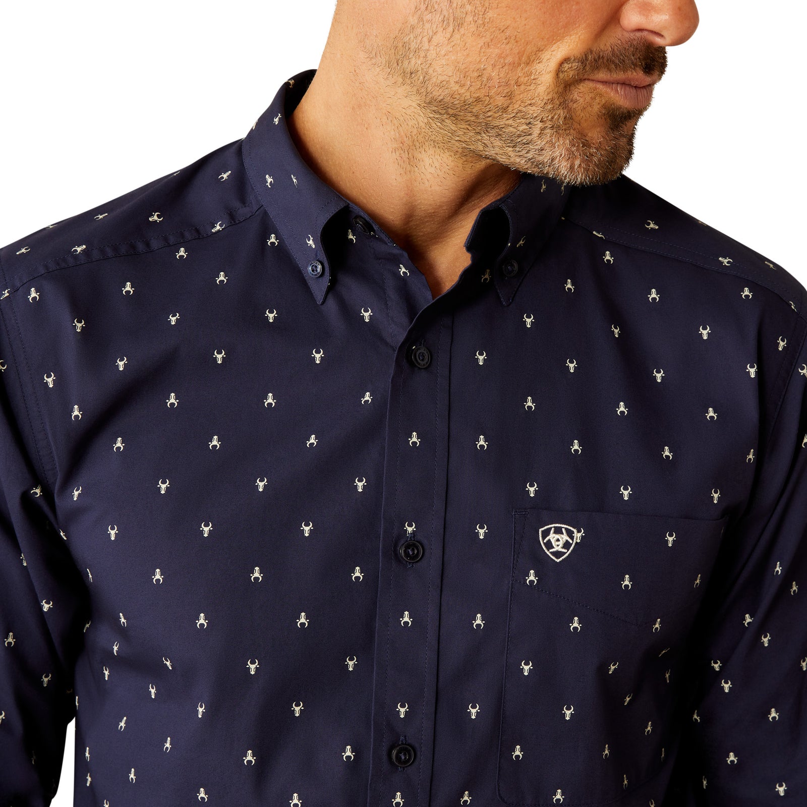 Ariat Men's Cordell Retro Fit L/S Western Shirt. Navy blue shirt with white pattern worn by a person