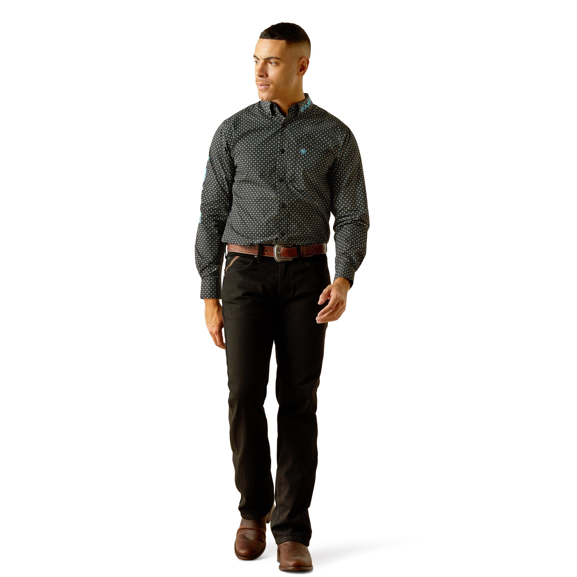 Ariat Men's Team Abel Fitted L/S Western Shirt. Man wearing a patterned shirt and dark pants on a white background
