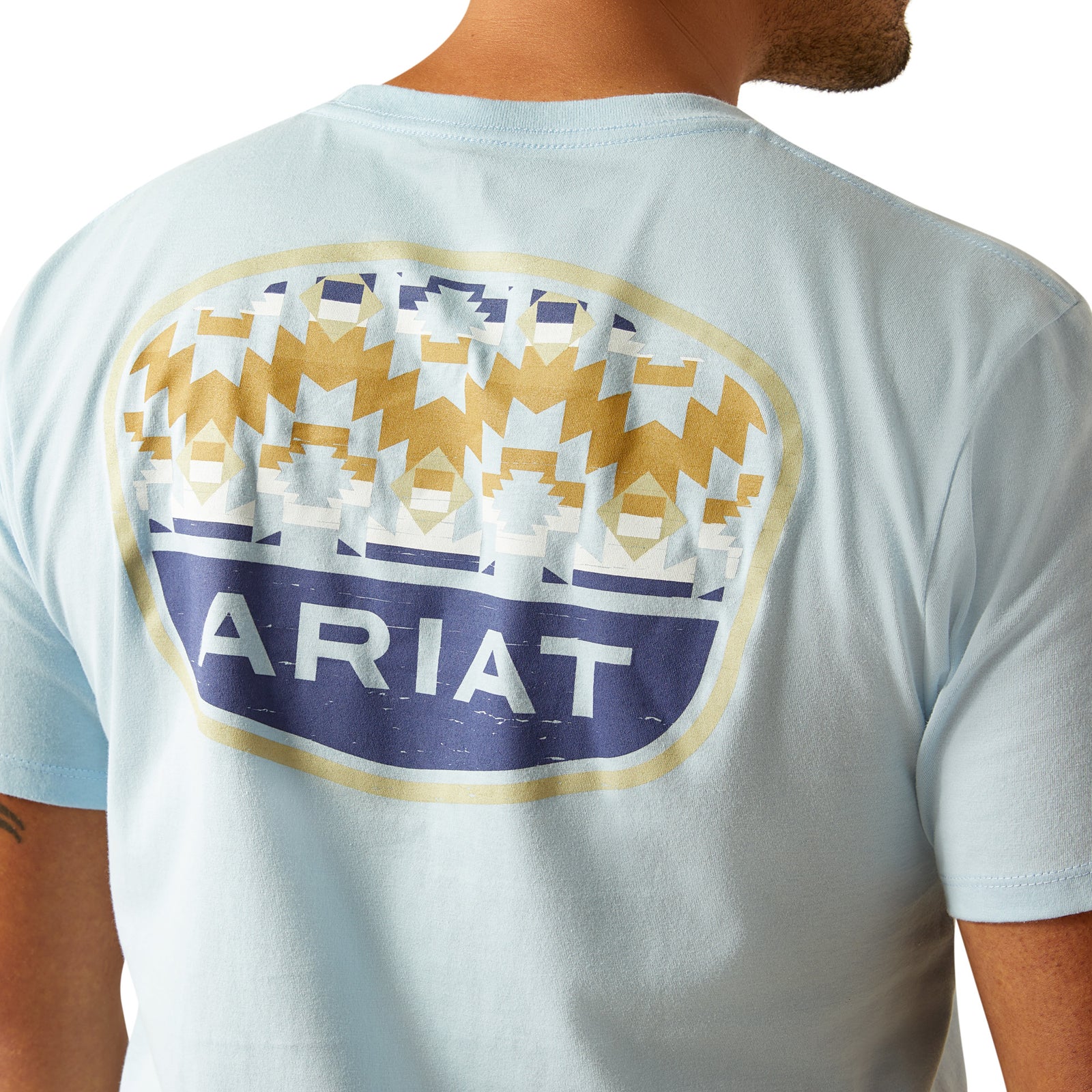 Ariat Men's Ogden Valley Badge T-Shirt. Light blue t-shirt with Ariat logo on the back