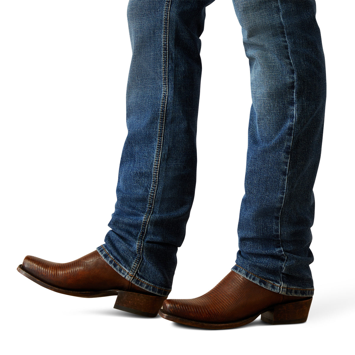 Ariat Men's M8 Miles Modern Fit Jean. Blue jeans and brown cowboy boots on a white background