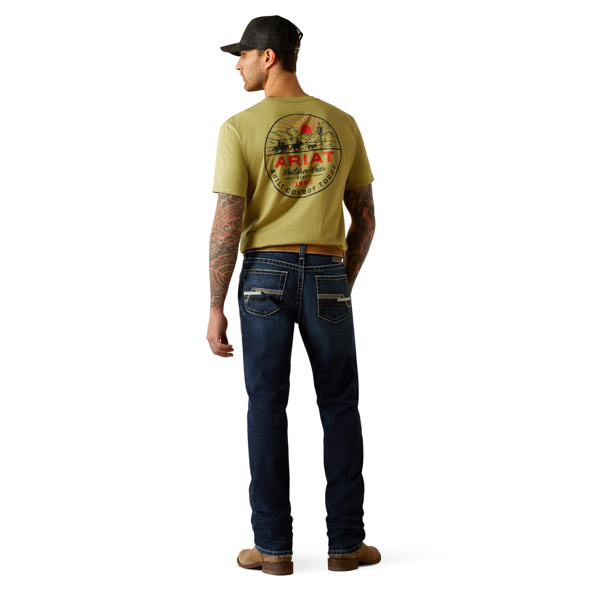 Ariat Men's M8 Modern Matthew Straight Leg Jean. Man wearing a green t-shirt with a logo and dark blue jeans on a white background