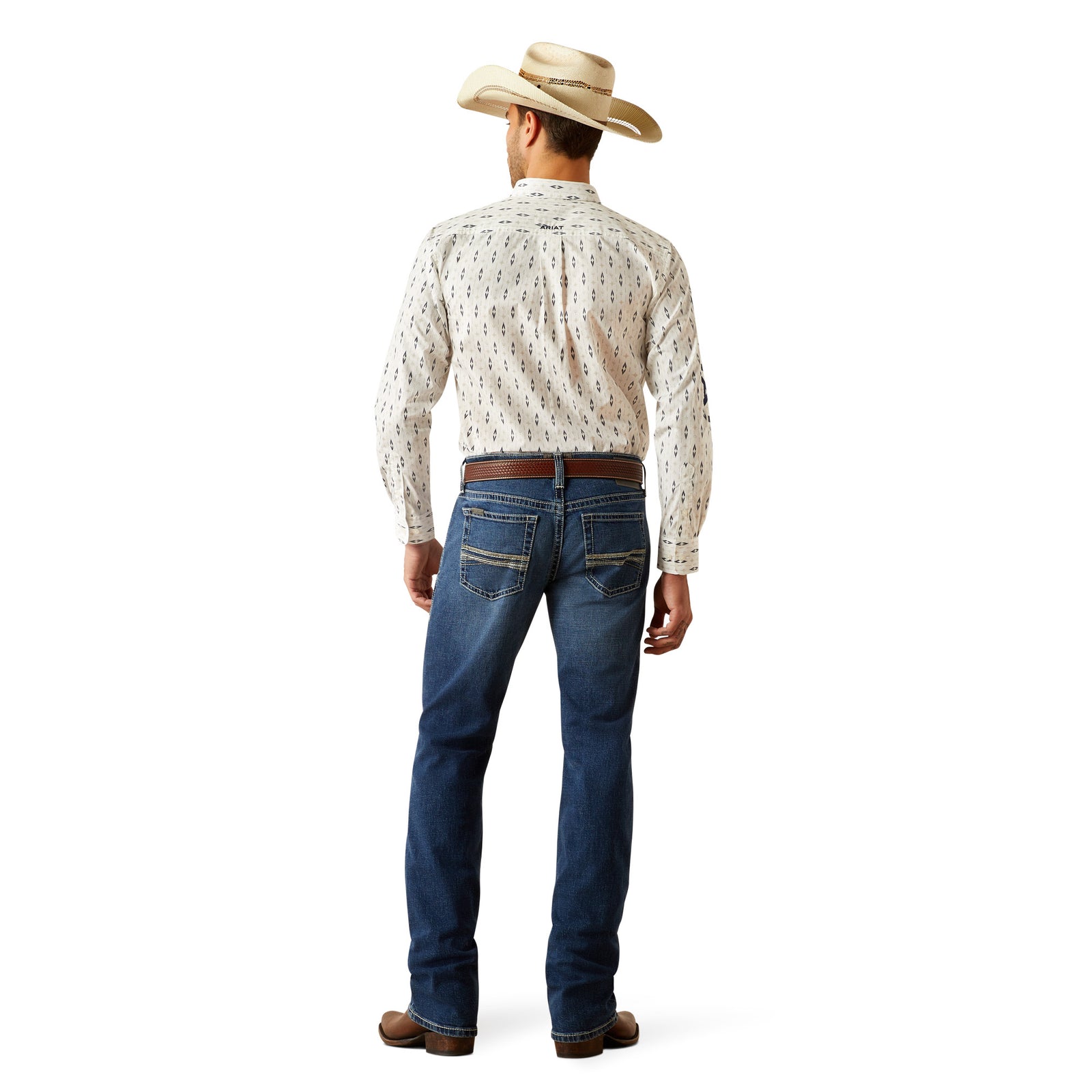 Ariat Men's M7 Wesley Slim Straight Leg Jean. A man wearing a pair of Ariat Men's M7 Wesley Slim Straight Leg Jeans with a white shirt and brown boots.