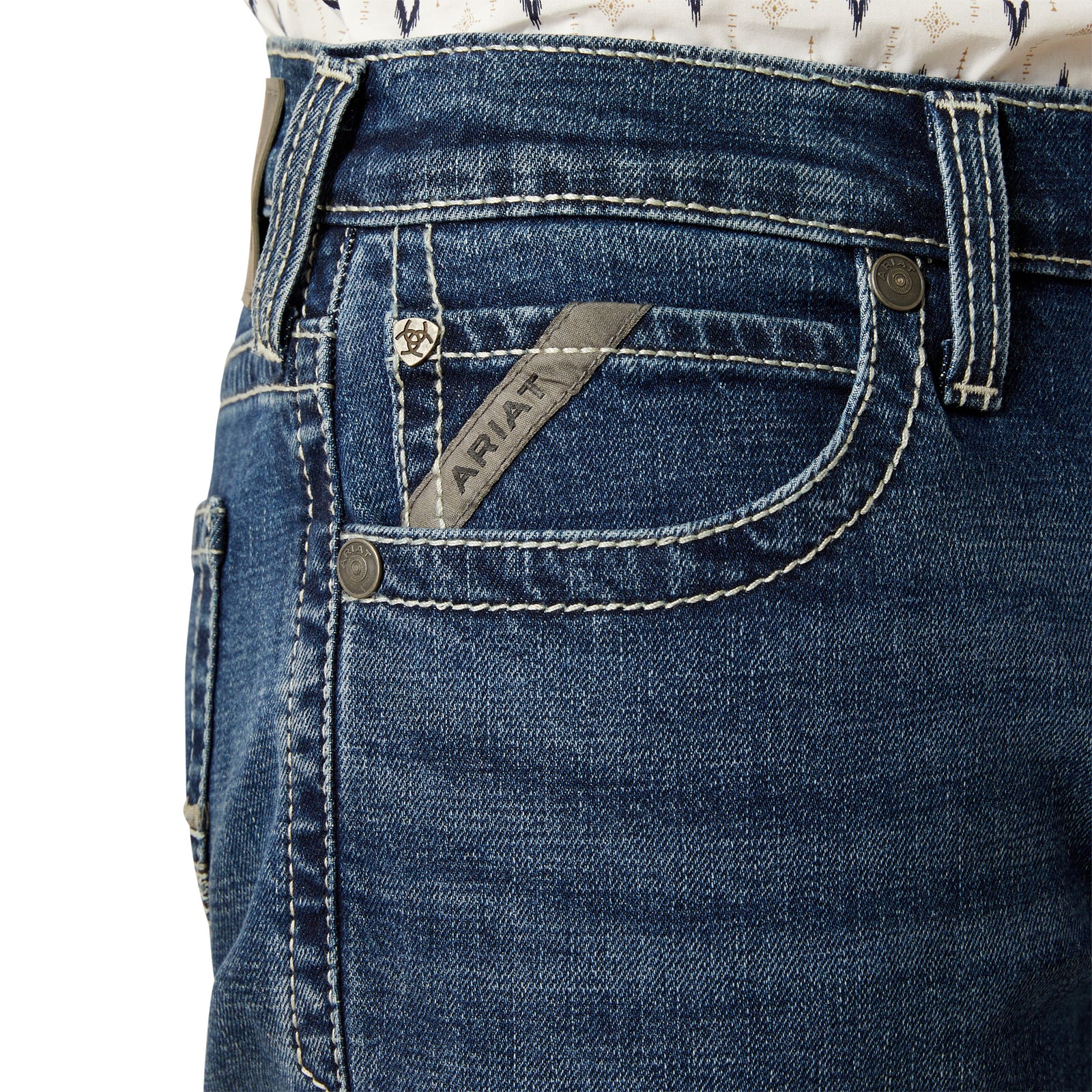 Ariat Men's M7 Wesley Slim Straight Leg Jean. Close-up of blue jeans with Ariat logo on pocket on a white background