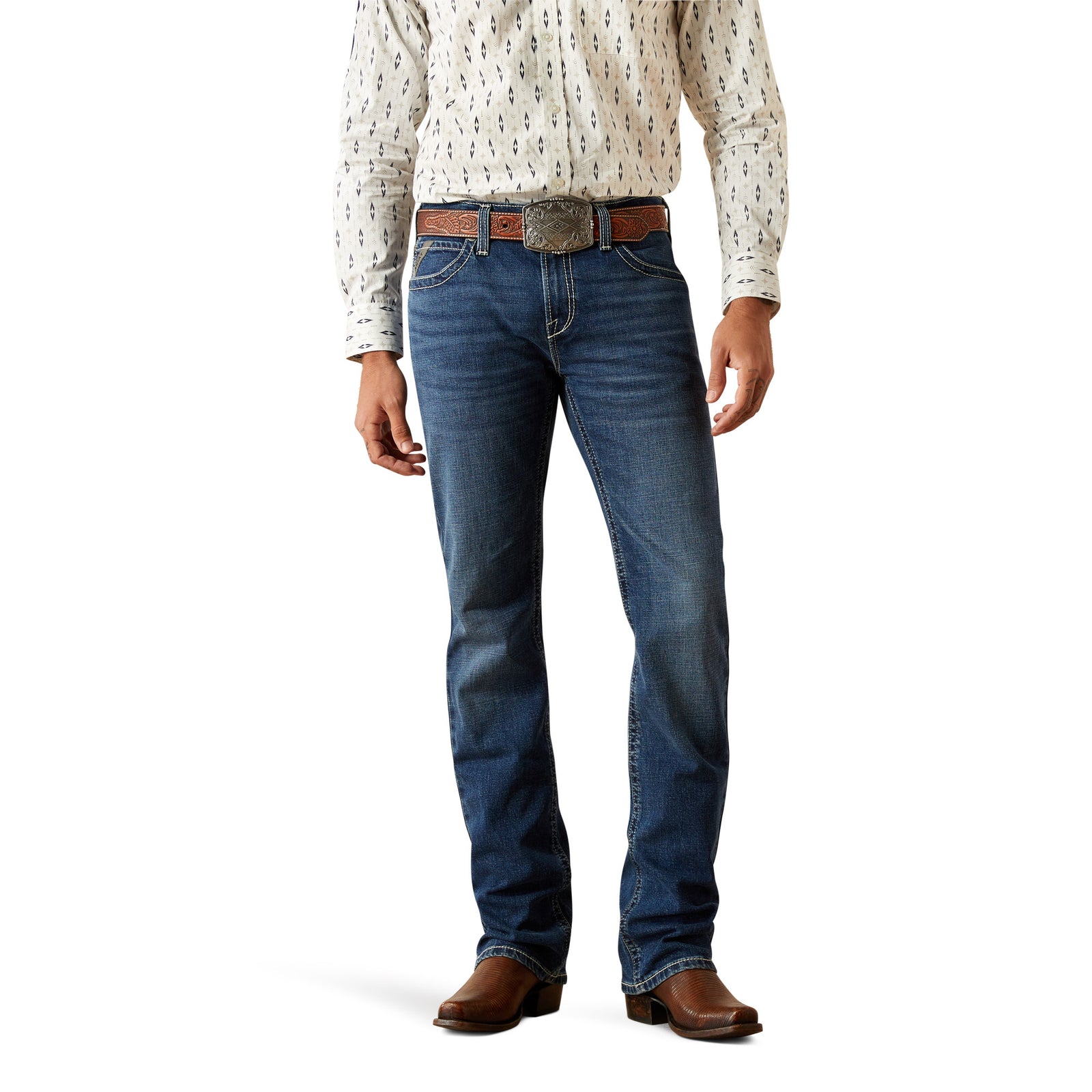 Ariat Men's M7 Wesley Slim Straight Leg Jean. A man wearing a pair of Ariat Men's M7 Wesley Slim Straight Leg Jeans with a white shirt and brown boots.