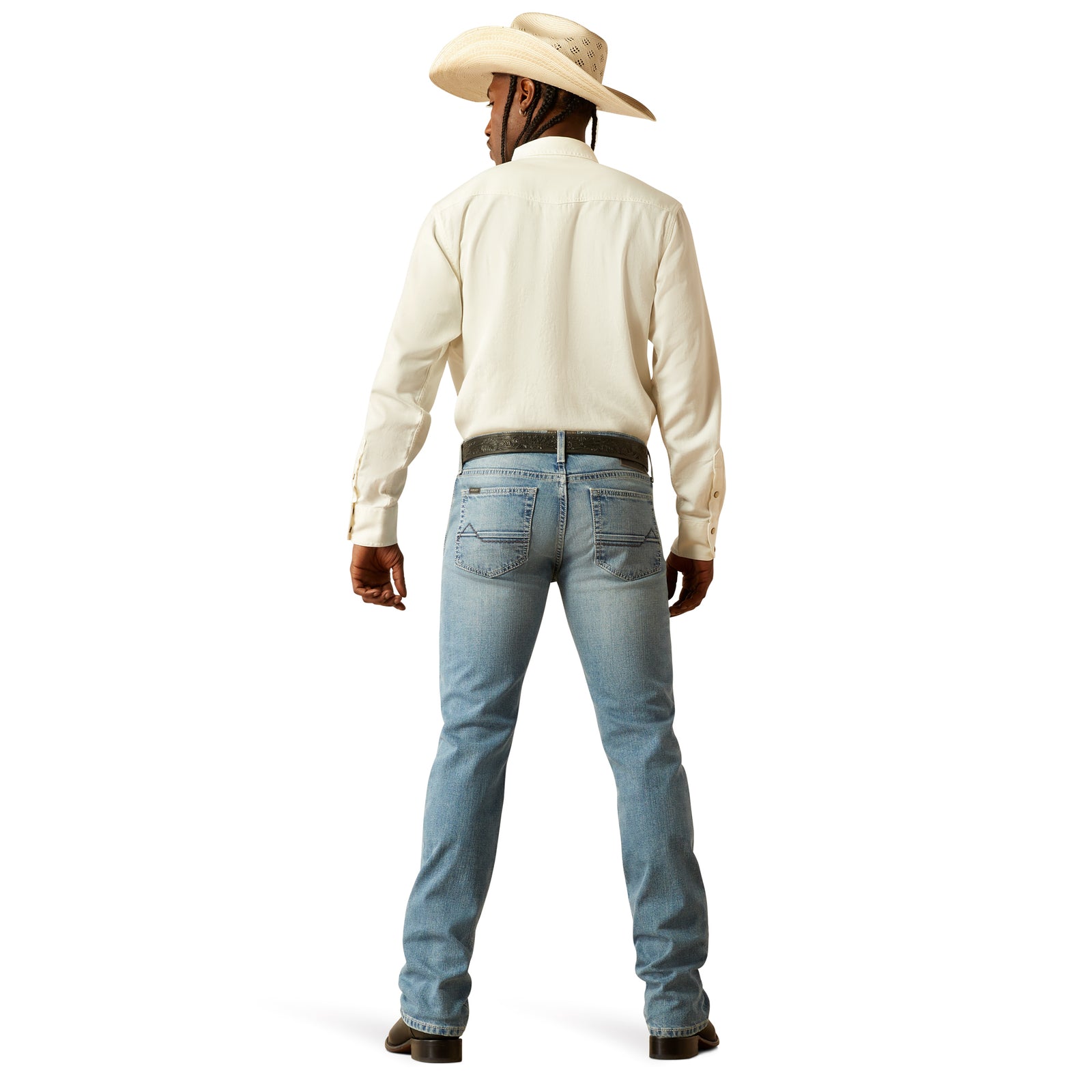 Ariat Men's M7 Ethan Slim Straight Leg Jean. A man wearing slim straight leg blue jeans and a white shirt with rolled-up sleeves.