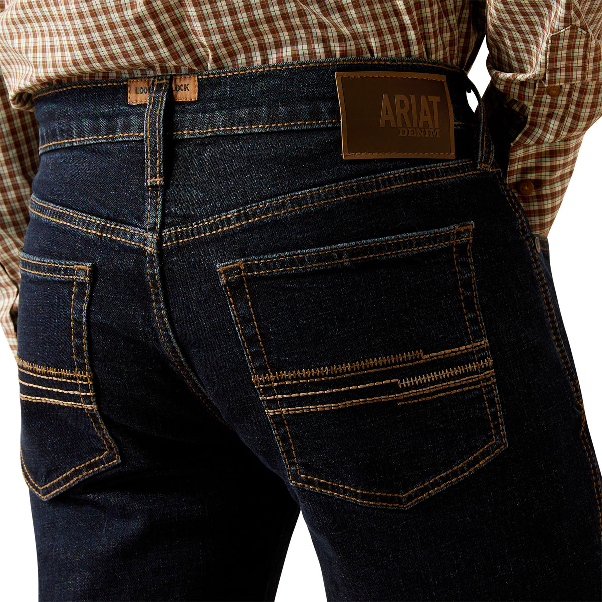 Ariat Men's M5 Dexter Straight Leg Jean. Dark blue jeans with a visible Ariat logo on a white background