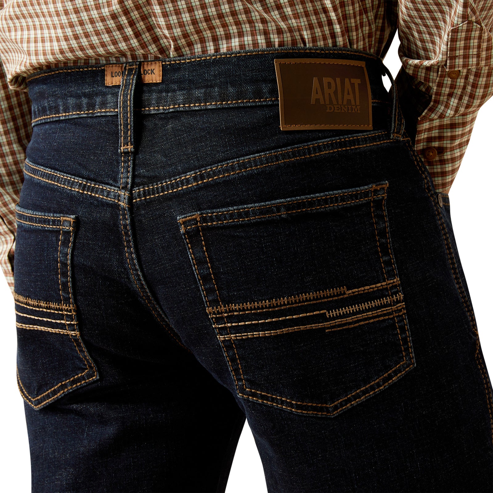 Ariat Men's M5 Dexter Straight Leg Jean. Dark blue jeans with a visible Ariat logo on a white background