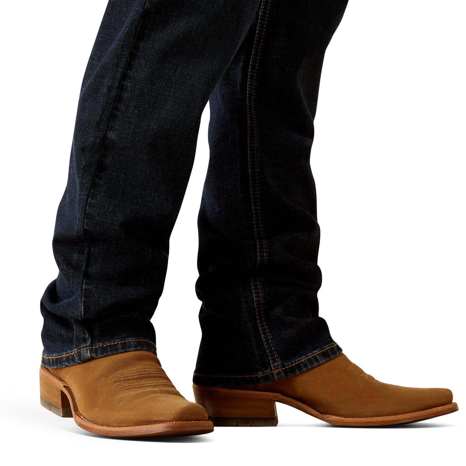 Ariat Men's M5 Dexter Straight Leg Jean. Brown cowboy boots worn with dark blue jeans on a white background