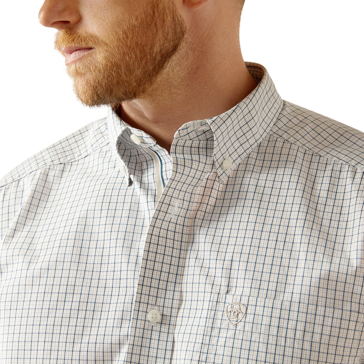 Ariat Men's Pro Series Stone L/S Western Shirt. Close-up of a man wearing a checkered shirt with a visible brand logo.