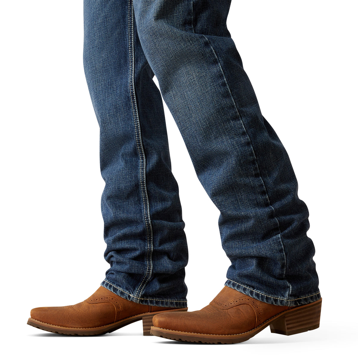 Ariat Men's M2 Camilo Boot Cut Jean. Blue jeans and brown boots on a white background