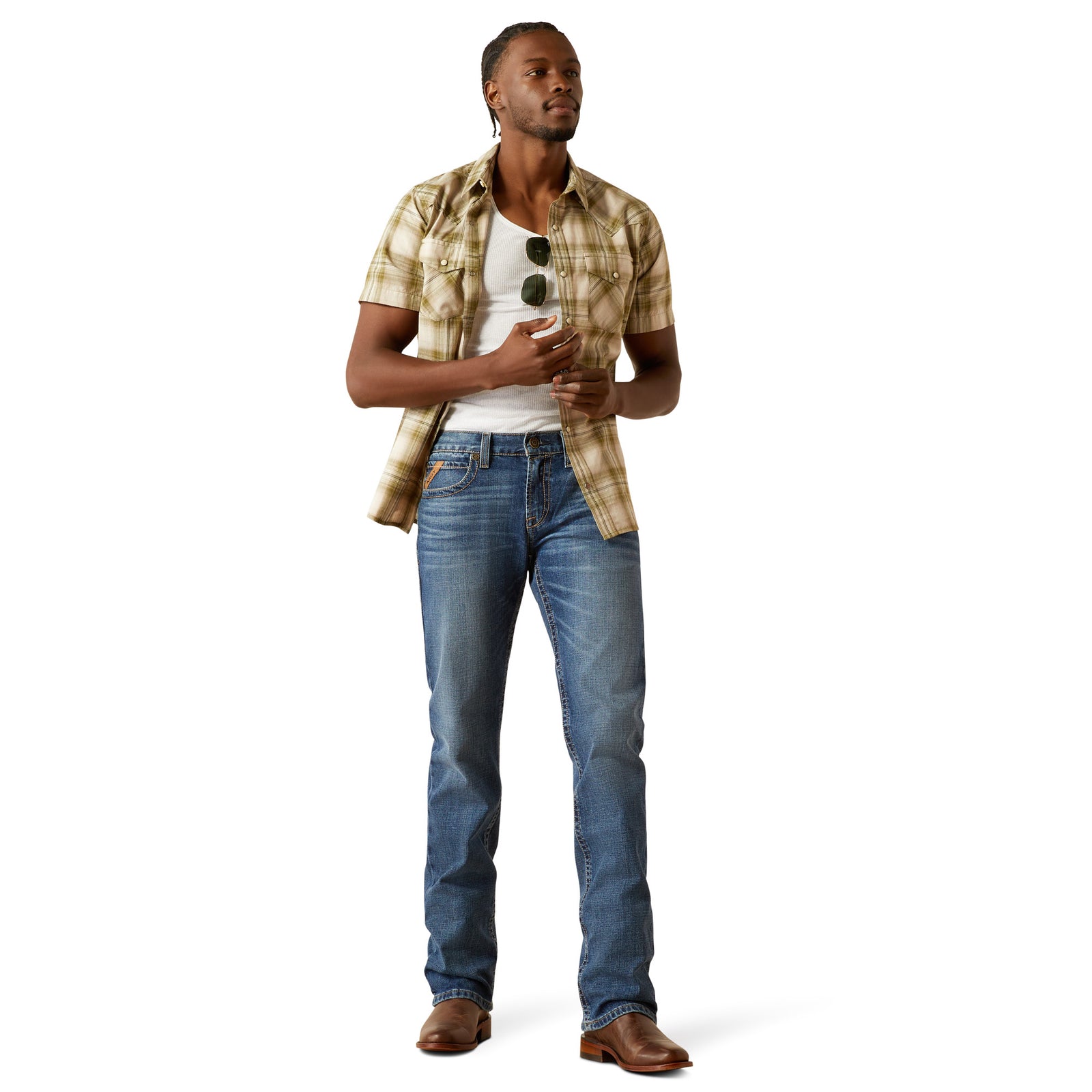 Ariat Men's M7 Travis Straight Leg Jeans. Man wearing a plaid shirt, white t-shirt, and blue jeans on a white background