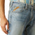 Ariat Men's M7 Tustin Slim Fit Straight Leg Jean. Close-up of blue jeans with Ariat branding on a white background