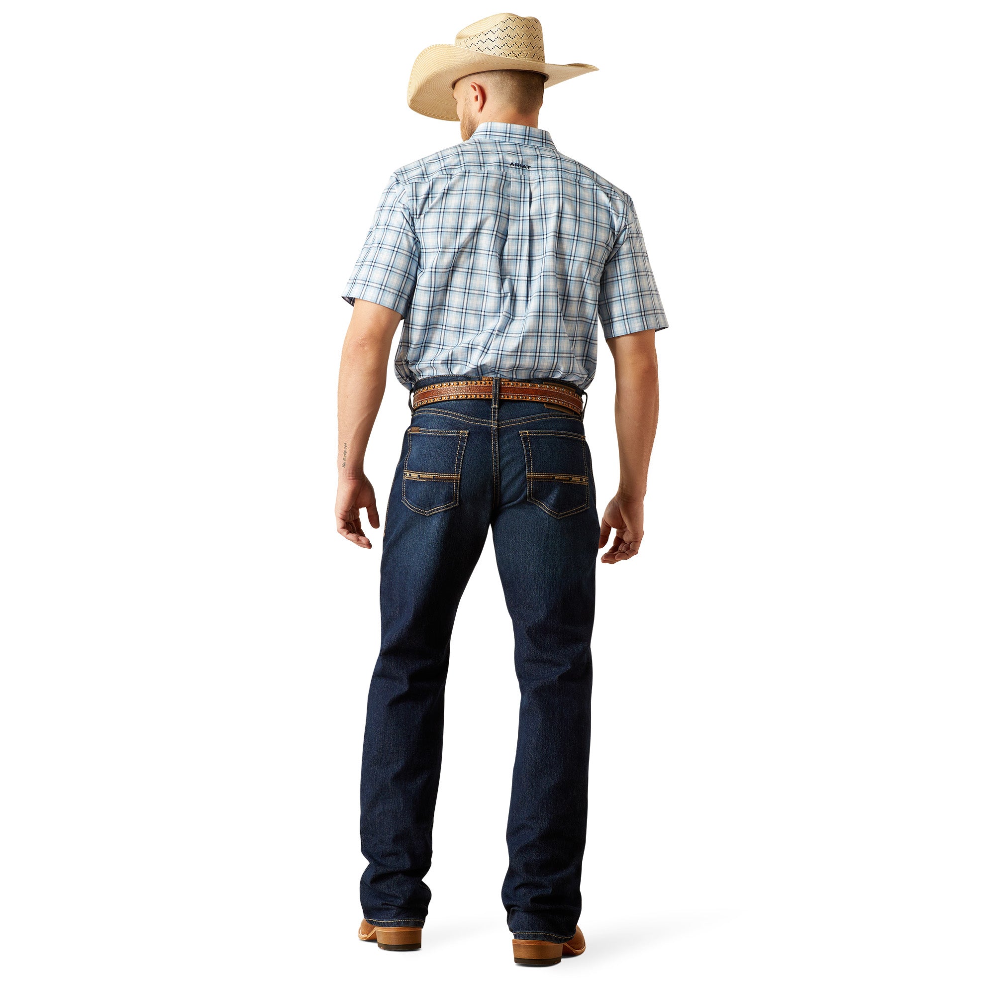 Ariat Men's M4 Otis Boot Cut Jean. Person wearing blue jeans and a plaid shirt on a white background