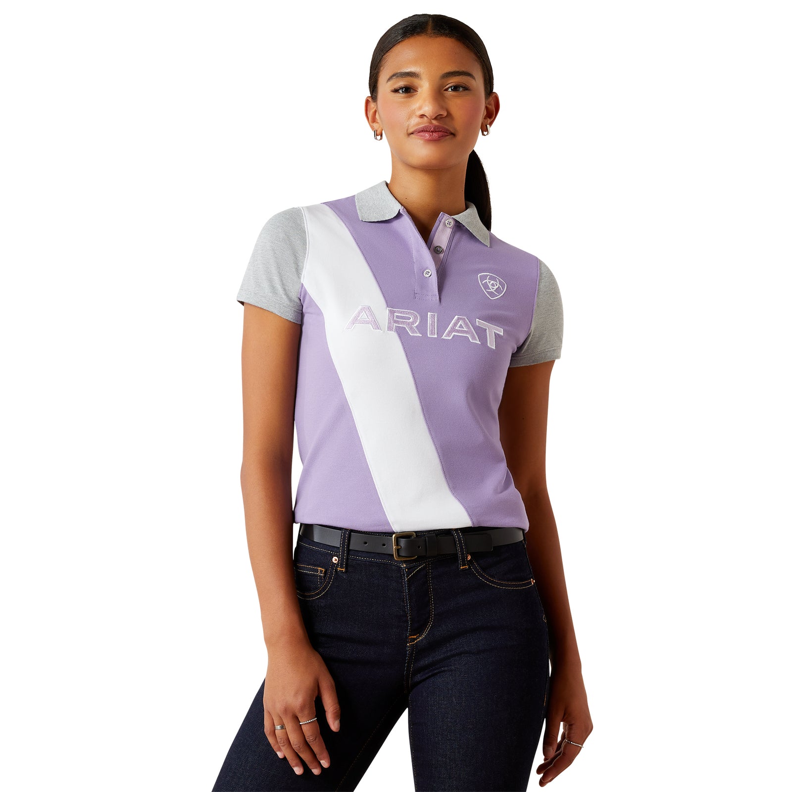 Ariat Women's Taryn Polo. Woman wearing a purple and white polo shirt with 'Ariat' branding on a white background