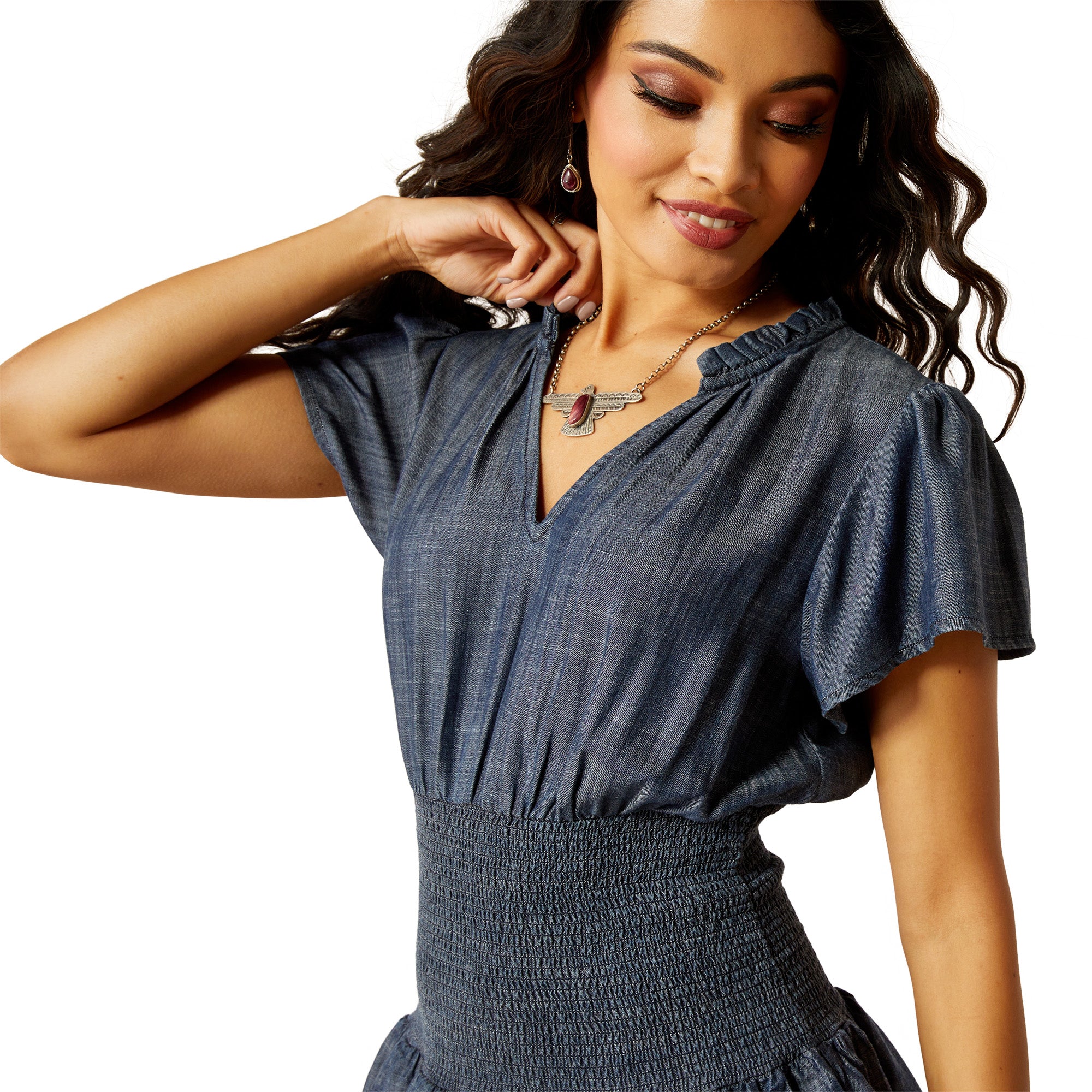 Ariat Women's Stellar Dress. Woman wearing a blue dress with a necklace on a white background