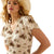 Ariat Women's Stellar Dress. Woman wearing a patterned dress and straw hat on a white background