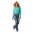 Ariat Women's Kirby Pro L/S Western Shirt. Woman wearing a turquoise shirt and blue jeans on a white background