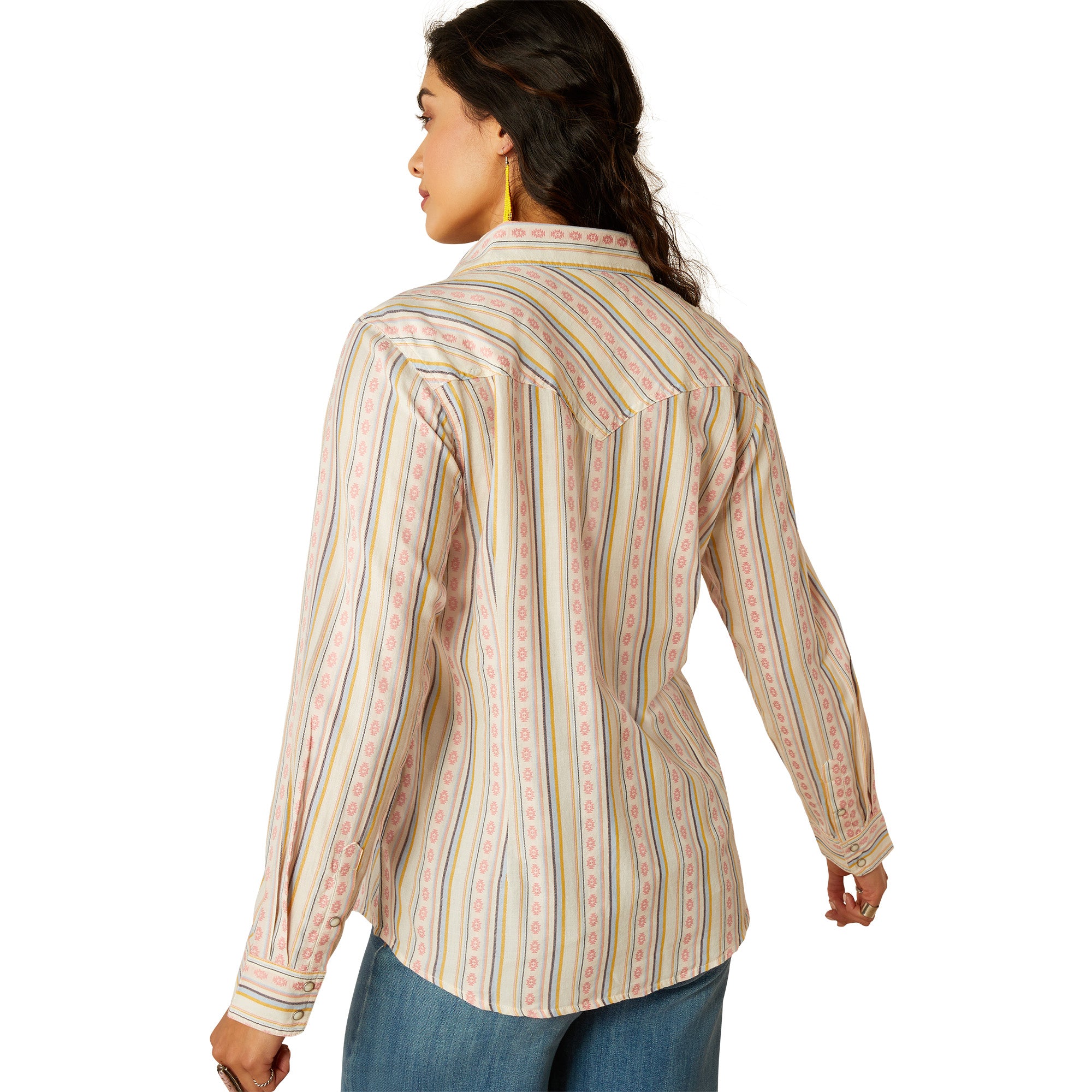 Ariat Women's Alyssa Snap L/S Western Shirt. Woman wearing a patterned shirt and jeans on a white background