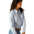 Ariat Women's Wrinkle Resistant Team Kirby Western Shirt. Woman wearing a light blue shirt with colorful patterns on sleeves against a white background