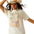 Ariat Women's Rodeo T-Shirt. Woman wearing a white t-shirt with a graphic design and a cowboy hat on a plain background