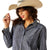 Ariat Women's Billie Jean L/S Western Shirt. Woman wearing a blue patterned shirt and white pants with a straw hat on a white background