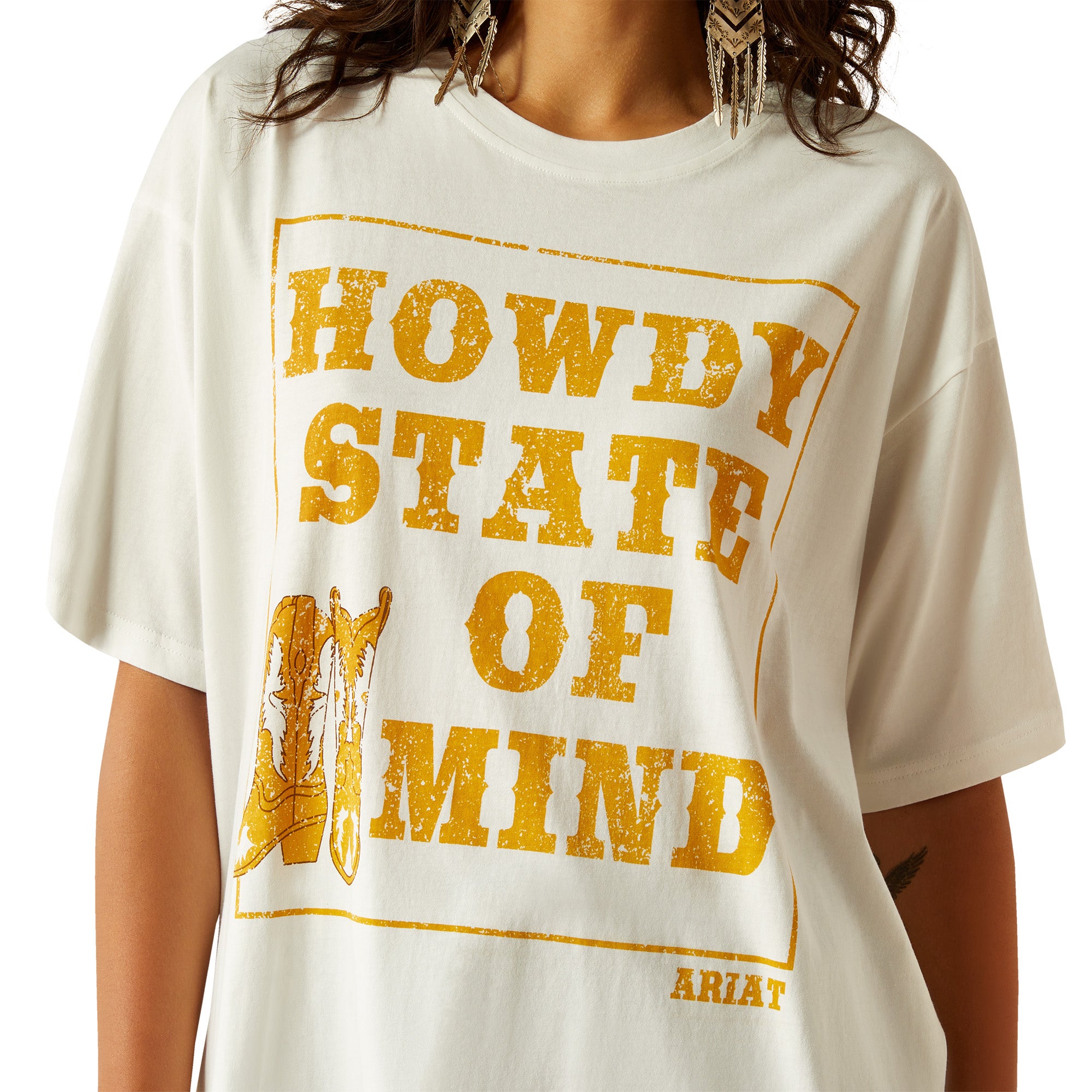 Ariat Women's Howdy State T-Shirt. Woman wearing a 'Howdy State of Mind' t-shirt with a white background