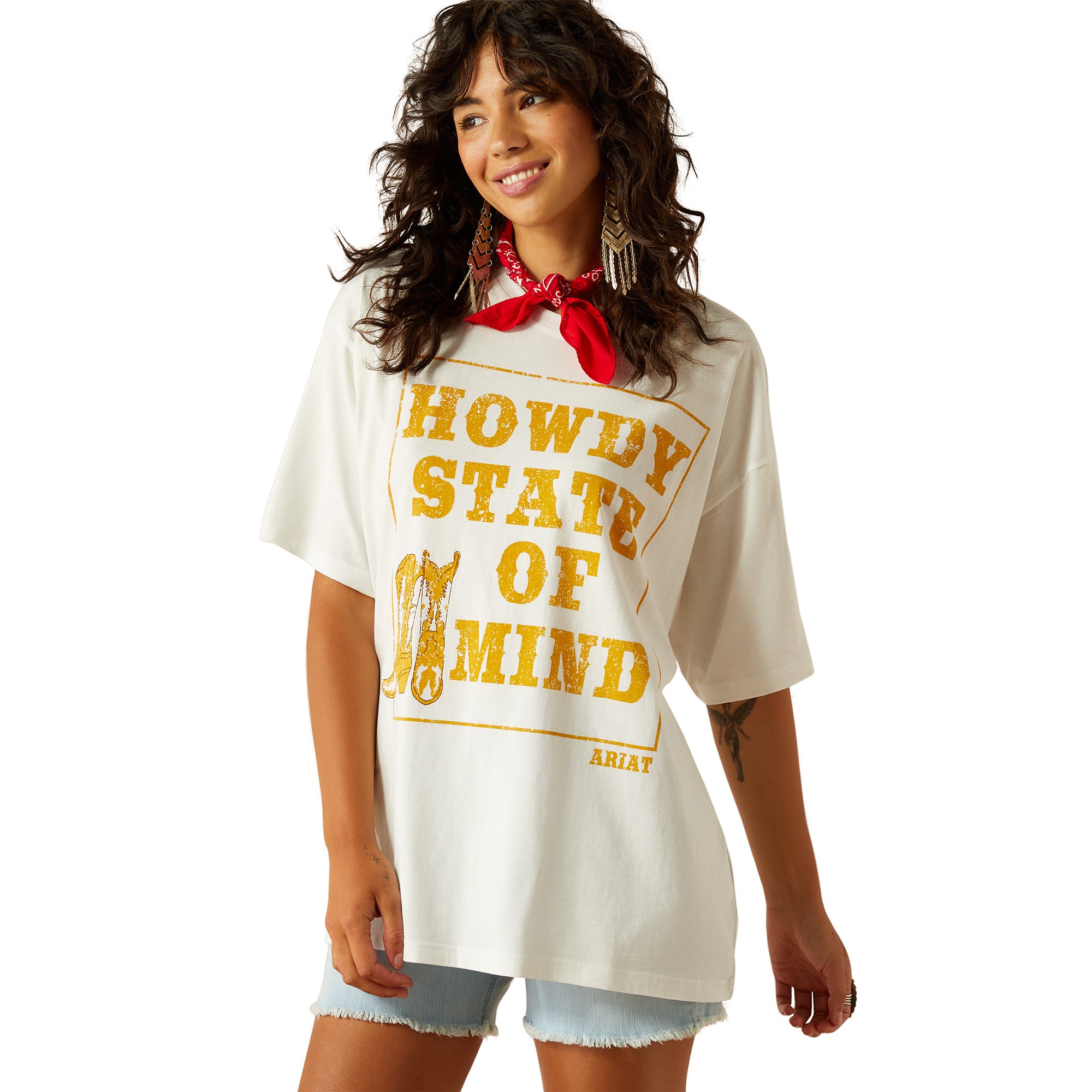 Ariat Women's Howdy State T-Shirt. Woman wearing a 'Howdy State of Mind' t-shirt with a white background