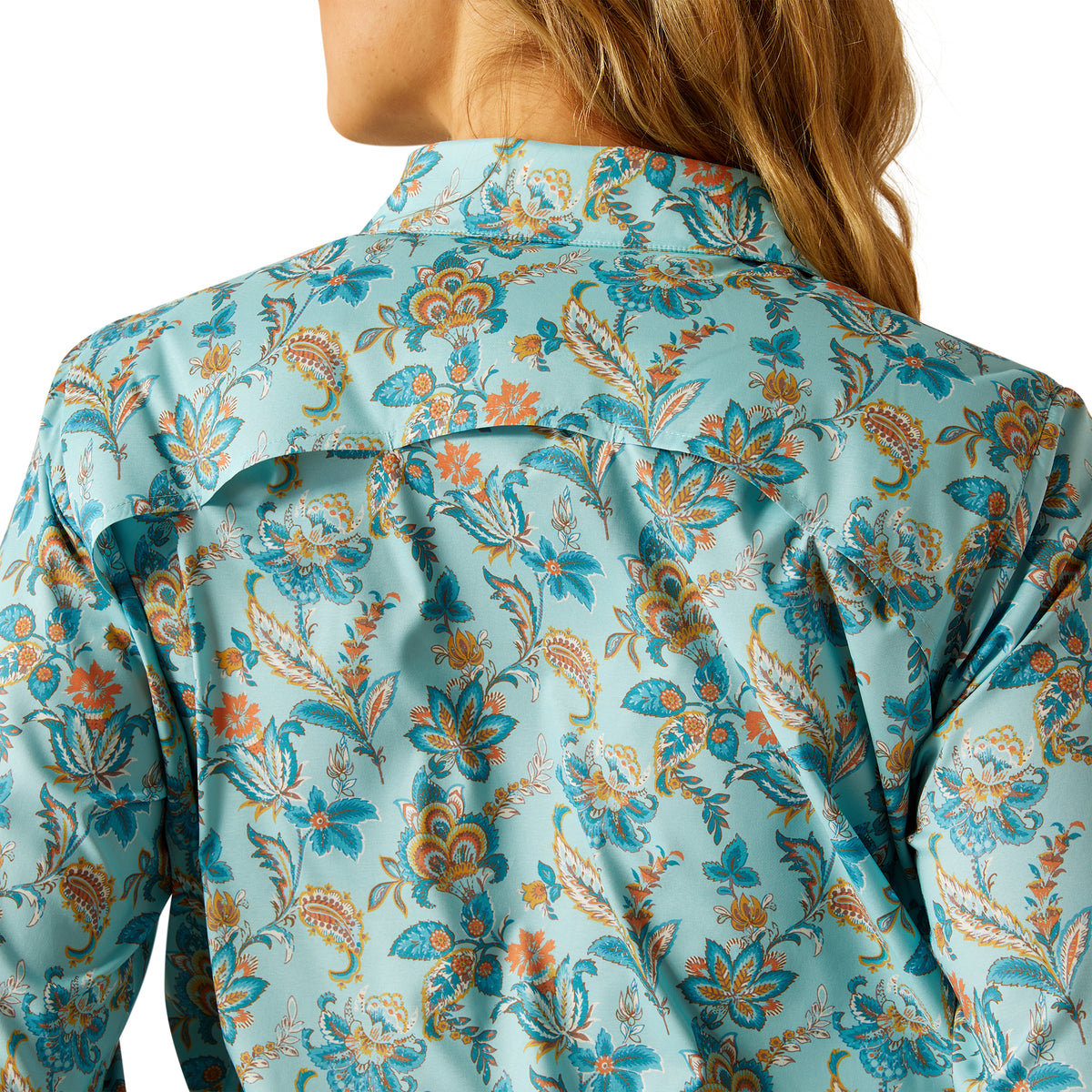 Ariat Women's VentTEK L/S Western Shirt. Close-up of a floral-patterned shirt with a blurred background